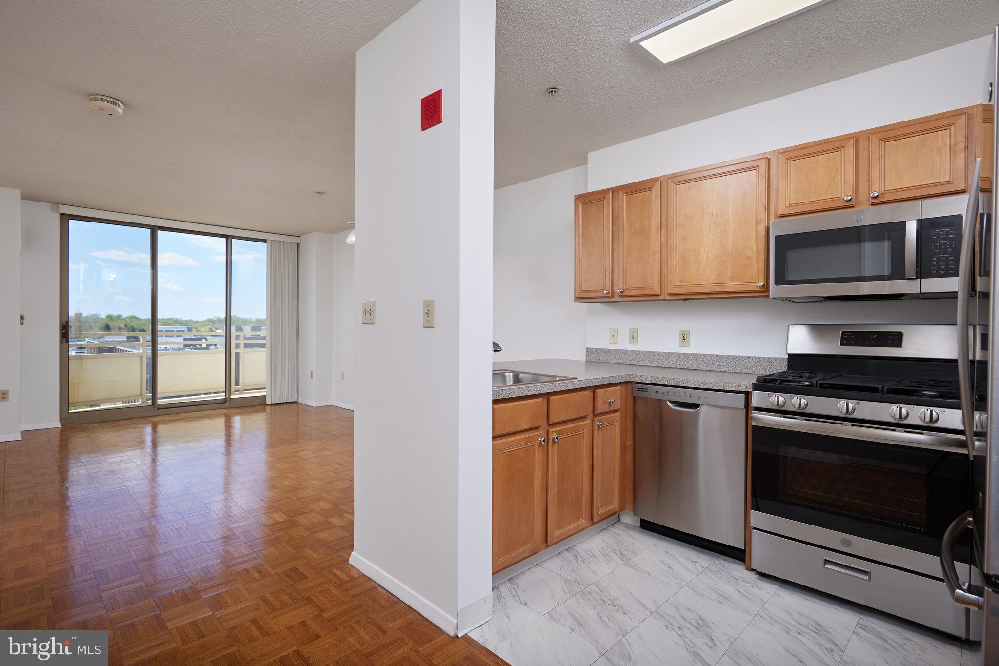 Welcome to the penthouse, unit 903 in Crescent Plaza. The hardwood floors and large windows create a bright and inviting atmosphere with panoramic views of Downtown Bethesda from the private outdoor space. 
The open-concept kitchen with stainless steel appliances and granite countertops is perfect for both everyday cooking and entertaining guests. 

The large primary bedroom with a walk-in closet offers ample storage space, and having a full bath with an in-unit washer and dryer adds convenience. 
This unit come with an assigned garage parking space,  a valuable bonus in a bustling area like Bethesda. No Pets. Call agent with any questions.