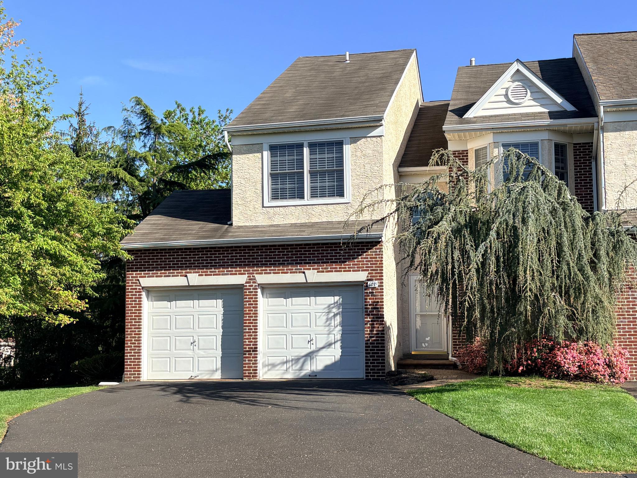 Great opportunity to own a beautiful end unit, two car garage townhome in the much sought after community of The Enclave at Belle Aire, featuring professionally finished basement with 4th bedroom. First floor has open concept floor plan with 9’ ceilings, allowing for easy flow and lots of natural light.  Enter the 2 story foyer and spacious dining room, with new luxury vinyl plank floors and bay window.  Next, you’ll find the kitchen with 42” cabinets, new quartz countertops, luxury vinyl plank floors, recessed lights, open to breakfast room, with ceiling fan,, which is conveniently located leading to newly stained deck, facing tree lined space.  Enjoy those cool nights in front of the new gas fireplace in your spacious, expanded great room with skylights and vaulted ceiling.  Powder room completes the first level. Move upstairs to find 3 spacious bedrooms boasting huge primary bedroom, with double door entry and ceiling fans, which will become your sanctuary, including large walk-in closet.  En-suite features soaking tub, stall shower, two vanities, and linen closet.  Completing the second floor are two generous bedrooms, full bath, and laundry area.  Downstairs you’ll find fully finished basement including bedroom with egress, full bath, and additional living space.   Roof replaced in 2019 and HVAC replaced in 2012.   Great location is another plus of this wonderful home, centrally located within close proximity to great shopping, shops in downtown Ambler, restaurants, major roads and train.   Award winning Upper Dublin schools!  Don’t wait to make this home your own!Selle