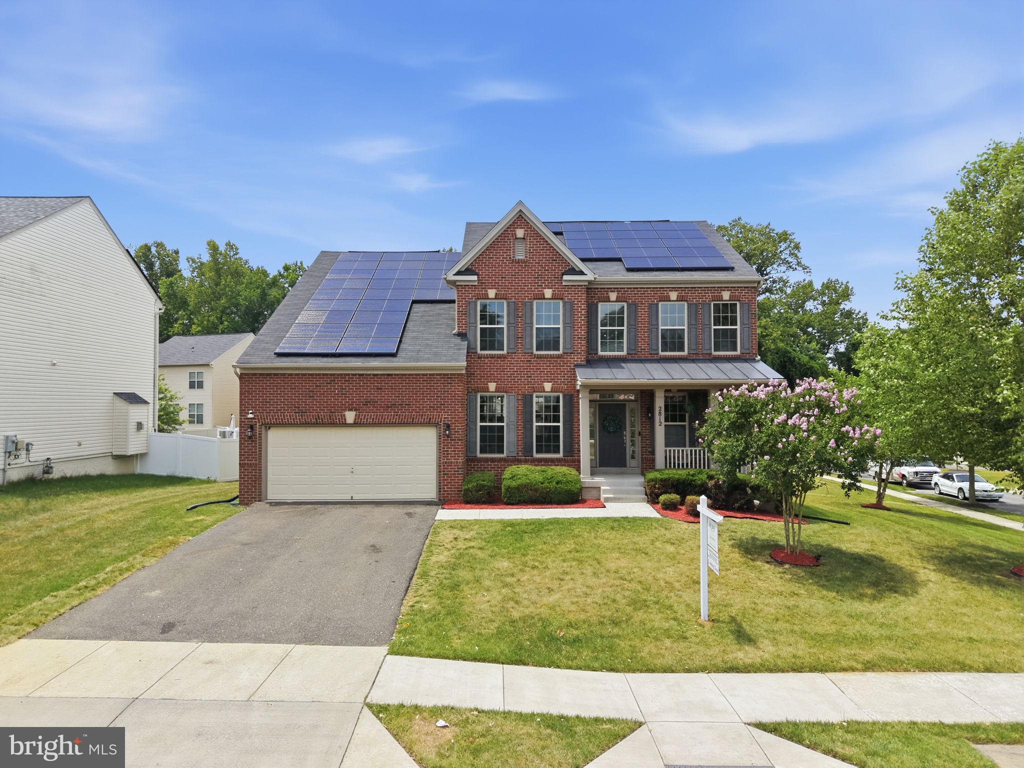 Welcome to this spectacular, designer’s choice 6-bedroom, 4.5-bathroom custom masterpiece, perfectly situated within easy walking distance of the premier shopping, dining, and entertainment at Woodmore Towne Centre. This home is a rare blend of high-end creativity and thoughtful functionality, beginning on the main floor where an open-concept layout inspired by international travel delivers absolute bohemian perfection. Sunlight floods the space from all angles, illuminating a timeless palette of neutral colors, rich textures, custom coffered ceilings, and whimsical light fixtures that set this property apart. Designed to accommodate modern lifestyles, the layout boasts incredible flexibility for multi-generational living, featuring a coveted in-law suite on the first floor and an additional private guest suite in the fully finished basement. The upper level continues the bespoke design journey with uniquely themed retreats: the first bedroom is a sophisticated, black-and-white "jewelry box" blending classic charm with trendy statement pieces; the second bedroom is a vibrant, youth-centric nod to anime lovers featuring a modern acrylic headboard, a stunning reed wall mural, and a seamless Frame TV gallery wall; and the third bedroom is a massive princess suite turned gaming sanctuary, boasting a floor-to-ceiling vibe complete with a fully organized walk-in closet, a swanky private bathroom, and a dedicated workspace. Truly a designer's dream with immense attention to detail at every turn, this one-of-a-kind home must be seen in person to be fully appreciated.