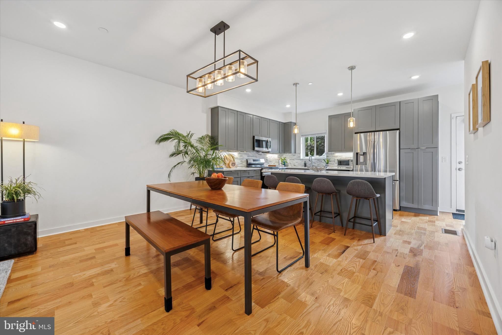 Welcome to the contemporary living of 7005 Pipers Glen. This modern townhome offers an unbeatable combination of style, convenience, and value—with five years of tax abatement remaining, making it an exceptional investment opportunity. Situated in the heart of Mount Airy, Philadelphia's most vibrant community. The main level offers an open-concept living, dining, and kitchen area, ideal for entertaining. Hardwood floors guide you to the spacious kitchen, which features stainless steel appliances, a double fridge, and a convenient eat-in island. From the kitchen, you can seamlessly access the tidy rear garden and spacious finished lower level. Travel to the second floor to find the gracious light-filled primary bedroom with an oversized ensuite bathroom that allows you to relax and unwind in the fully tiled walk-in shower with a glass enclosure. The oversized, fully fitted walk-in closet provides a luxurious amount of storage. Also on this floor, you'll find a second bedroom, which is the perfect complement and makes a great nursery or study. The completely renovated third level offers two additional well-sized bedrooms, a full bath, and new hardwood throughout. Ascend to your private rooftop terrace, a secluded sanctuary with privacy walls on both sides and a lovely green roof. The totally finished lower level is great for a family room, theater, or gym. It includes another full bathroom which also makes this level perfect for a guest suite. The unbeatable location is situated next to markets, restaurants, shops, playgrounds, and the library. Enjoy immediate access to a multitude of community treasures and the unique, vital lifestyle that only Mount Airy has to offer. Make 7005 Pipers Glen yours!
