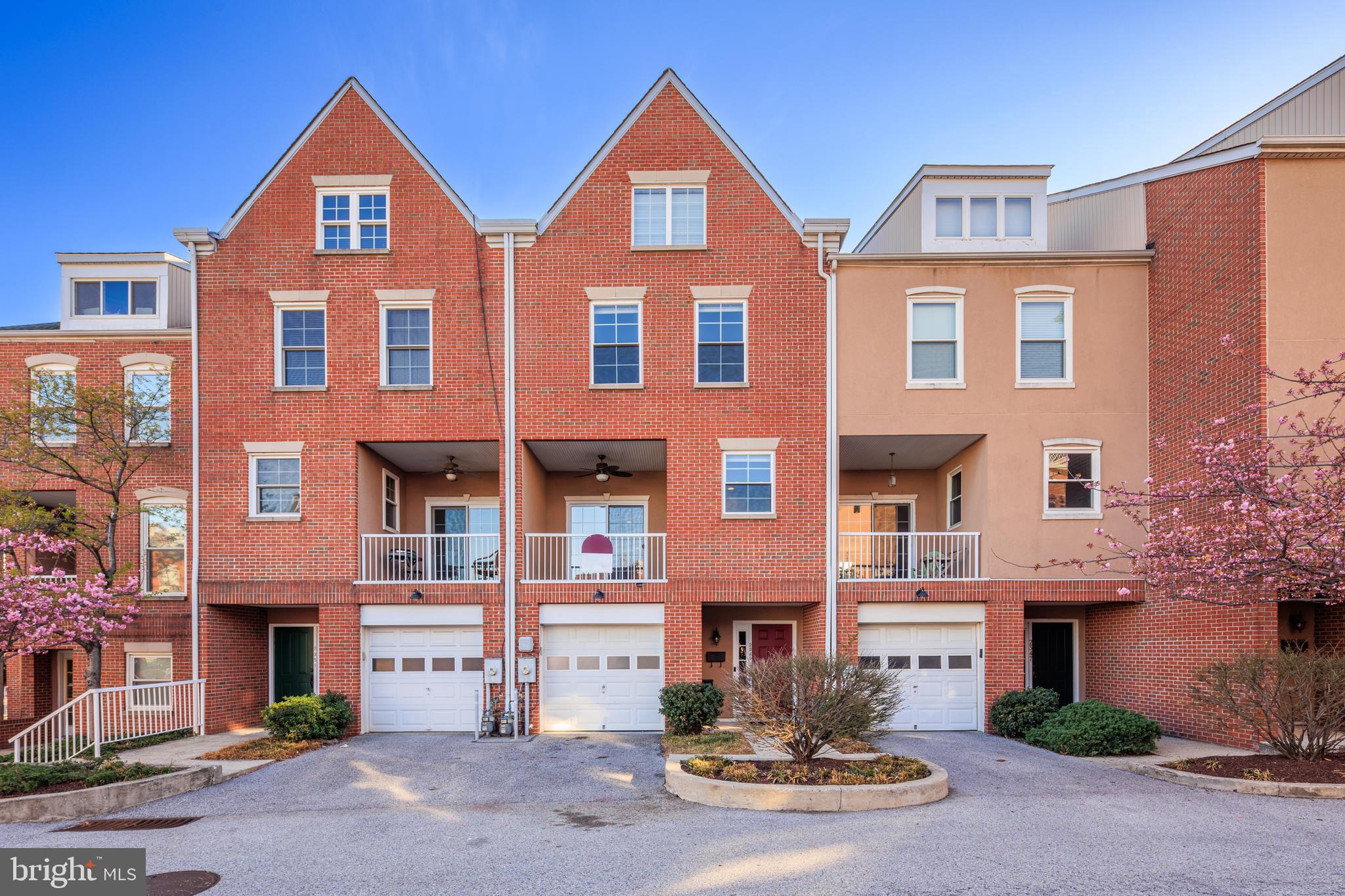 Stunning 3BR/3.5BA featuring garage AND off street driveway parking in prime Canton location...just one block from the water/promenade! 

Welcome to this beautifully updated, extra wide townhome offering the perfect blend of luxury, function, and location. Nestled just one block from the Canton waterfront, this spacious 3-bedroom, 3.5-bath home features four levels of thoughtfully designed space, multiple outdoor spaces, garage and driveway parking. 

The entry-level features a spacious garage with custom built in storage, coat closet,  and a welcoming foyer. Towards the rear of the home, brand new LVP flooring leads you to  a spacious bedroom with large closet, private laundry hookups with utility sink, and a full bath — perfect for guests, a home office, or roommates! 

Designed for entertaining, the main floor (second level) boasts gleaming hardwoods, custom dimmable recessed lighting, and a spacious open-concept layout. The kitchen shines with stainless steel appliances, granite counters, a large custom built-in buffet/island with plenty of added storage, and an integrated workspace. The kitchen also features a charming balcony, extending the entertaining space. The dining and living room feature a cozy gas fireplace. A powder room completes this level. 

Upstairs, enjoy new hardwood flooring throughout. The luxurious primary suite offers cathedral ceilings, dual custom California Closets, and a spa-like bath with dual vanities, a steam shower, and a soaking tub. A large secondary bedroom also includes custom closet systems and is served by hall bath with new shower doors. The convenient upstairs laundry room provides ample storage and function! 

The fourth floor offers a flexible loft space with a built-in mini bar — perfect for a bonus living area, playroom, guest space, or home office. Step outside to the expansive rooftop deck with a retractable Sunbrella awning with automatic wind sensor. Take in panoramic water and city skyline views — a true entertainer’s dream.

This home has been thoughtfully upgraded with newer windows and HVAC systems, providing peace of mind and energy efficiency.

Perfectly positioned in one of Baltimore’s most desirable neighborhoods, you’ll enjoy walkable access to the waterfront promenade, top-rated restaurants in both Canton and Fells Point, shopping, and vibrant city life—all while savoring the comfort and elegance of home.