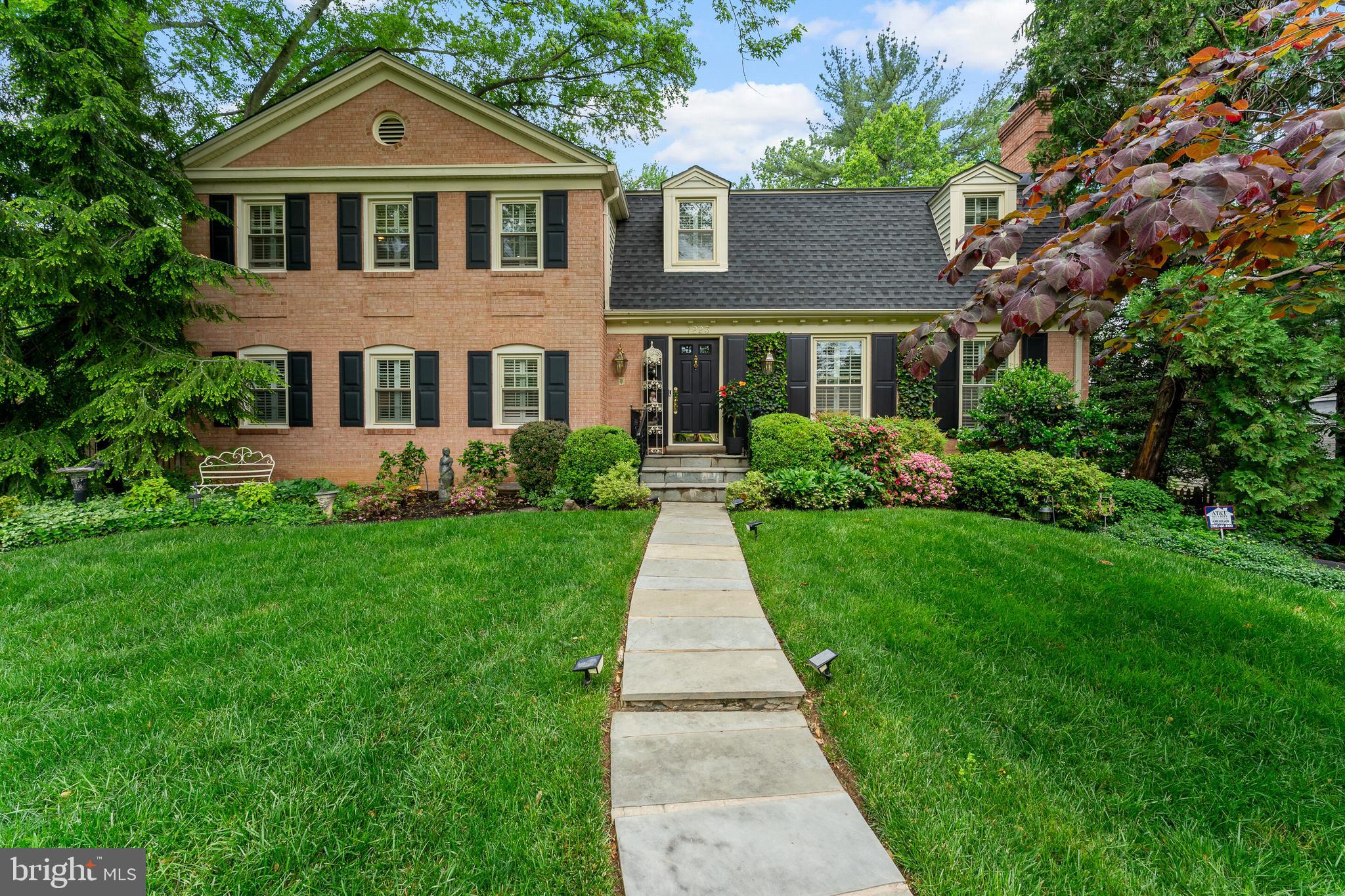 Welcome to this elegant 5 bedroom, 3 bath brick home in the heart of McLean! Tucked in a tranquil park-like setting, it features lush landscaping, mature trees and enchanting gardens. Fully fenced backyard.

Top-tier McLean schools.

The thoughtfully designed interior of this home exudes warmth and charm with a spacious living room, dining room, hardwood floors.  Kitchen, breakfast area, cozy family room with fireplace, adjoins solarium/sunroom.  Deck with panoramic views. Features: 3 fireplaces; Kohler jetted tub.  Spacious 2-car garage. 1/2 acre.

A Main Level Bedroom with ensuite bath is versatile, featuring custom-built shelves for a study or home office.

This home is only minutes to McLean shops, restaurants, and Tysons.  It is convenient to McLean Station Metro; Washington, DC amenities; and airports.