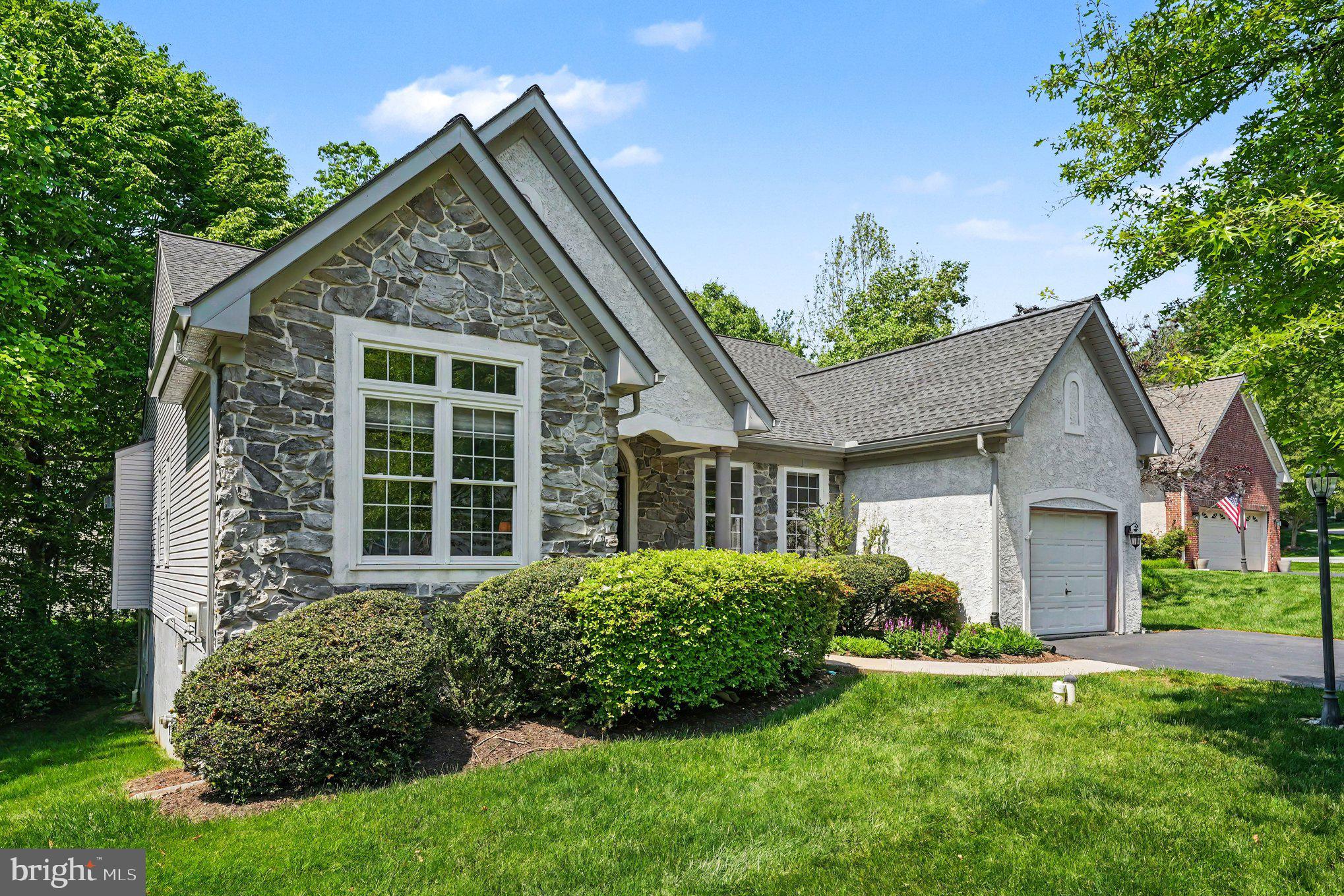 Welcome to Journeymans Trail; an Expanded Ranch style home with 2 floors of Living space. Tucked away on a quiet cul-de-sac with a gorgeous setting and exceptional curb appeal, this immaculate home offers the perfect blend of comfort, elegance, and low-maintenance living. Enjoy a short walk to the clubhouse, outdoor heated pool, tennis courts, and nearby walking trail, while backing to a peaceful environmental preserve for added privacy and scenic woodland views. Or just lounge on the private back-deck with a wonderful natural tree canopy or open the motorized retractable Awning for additional shade on a sunny day.  See why the highly desirable 55+ community of Downing Forge is the place to be! 

Step inside to a dramatic open floor plan featuring 9-foot ceilings, extensive hardwood flooring, custom millwork, and a gracious Living Room highlighted by a gas fireplace. The updated granite Kitchen offers a center island overlooking the beautiful Sunroom, with sliders leading to a private deck — the perfect place to relax and enjoy the natural surroundings.

Beautifully maintained home featuring major recent upgrades including a NEW Roof, NEW Furnace, newer replacement windows, and new gutters for added peace of mind. 
The full Walkout Lower Level offers a recently Finished Lower Level (24x27)  offers valuable additional living space with plenty of opportunity to Add a 3rd Bedroom since a Full Bathroom is already there — perfect for guests, entertaining, a home office, or recreation area. Additional highlights include updated appliances within the past few years along with pride of ownership throughout.

Meticulously maintained and truly move-in ready. Relax and enjoy easy living with nearby shopping, restaurants, major roadways, malls, the scenic Chester County countryside, and convenient access to Lancaster County — all from the heart of Downingtown’s premier active adult community.
Downing Forge offers an active and welcoming 55+ lifestyle with a vibrant clubhouse and a full calendar of social activities throughout the year. Residents enjoy a variety of clubs and gatherings including book discussions, card groups, golf outings, Mah Jongg, knitting circles, casual TGIF get-togethers, community luncheons, coffee meetups, crafts, and more — making it easy to stay connected and involved.

Community amenities include a large heated outdoor swimming pool, tennis courts, pickleball, bocce ball, shuffleboard, and scenic walking areas throughout the neighborhood.

Ideally located along the Brandywine River near the historic borough of Downingtown, Downing Forge provides convenient access to excellent restaurants, shopping, parks, nature trails, and public transportation. The community is also just minutes from major routes including the Pennsylvania Turnpike, Route 202, Lancaster Avenue, and the Route 30 Bypass, making travel throughout Chester County and beyond incredibly convenient.