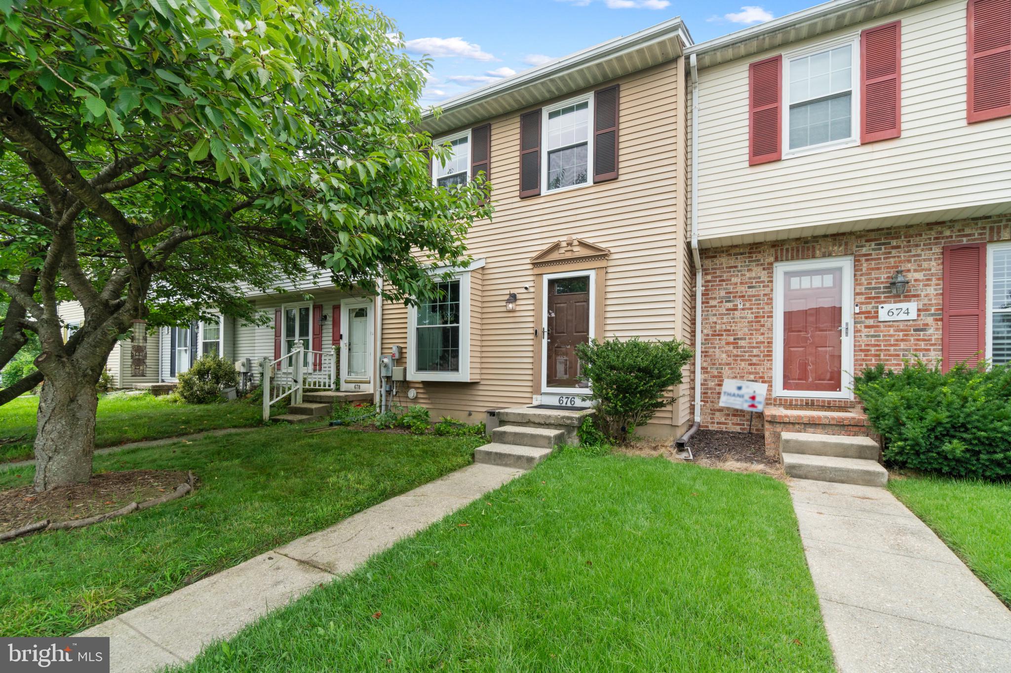 Welcome to 676 Cog Ct. tucked away in a tree lined community close to Annapolis and Glen Burnie. This three bedroom townhome has one full bathroom and half bathroom and a bonus den. This home has smart home features including Nest smart lock and touch keypad, smart assistant controlled through smart phone lights, Nest smoke/CO2 detector, and Nest Thermostat.  Walk into the front door where you will find a dining room to the left and the half bath off of the hall. The kitchen is also to the left and just beyond sits the living room is on the back of the home. On the rear of the living room main level a sliding screen door opens to a beautiful deck overlooking the greenery of the manicured and gardened fenced in back yard. The gardens in the backyard have irrigation running to them so that growing can be abundant. Up the stairs you will find three generously sized bedrooms with a full bathroom that is accessed from the hall. The basement features a large utility room with washer/ dryer and enough space for tons storage. Further towards the rear of the basement you will find a finished room that can be used as a second entertainment area or den. There is a door off of the rear of the basement which leads to the backyard. There are several gardens bearing fruit and vegetables that convey to the buyer. Enjoy upgraded flooring through the basement and main level. This home comes with two assigned parking spaces located right in front of the home. Lastly, this home is eco-friendly and has solar panels that have taken the bill from approximately $160/ month to $65/ month. The solar panels are paid for in full and convey with the home. Peaceful , tech savvy and eco-friendly living awaits at 676 Cog Ct.