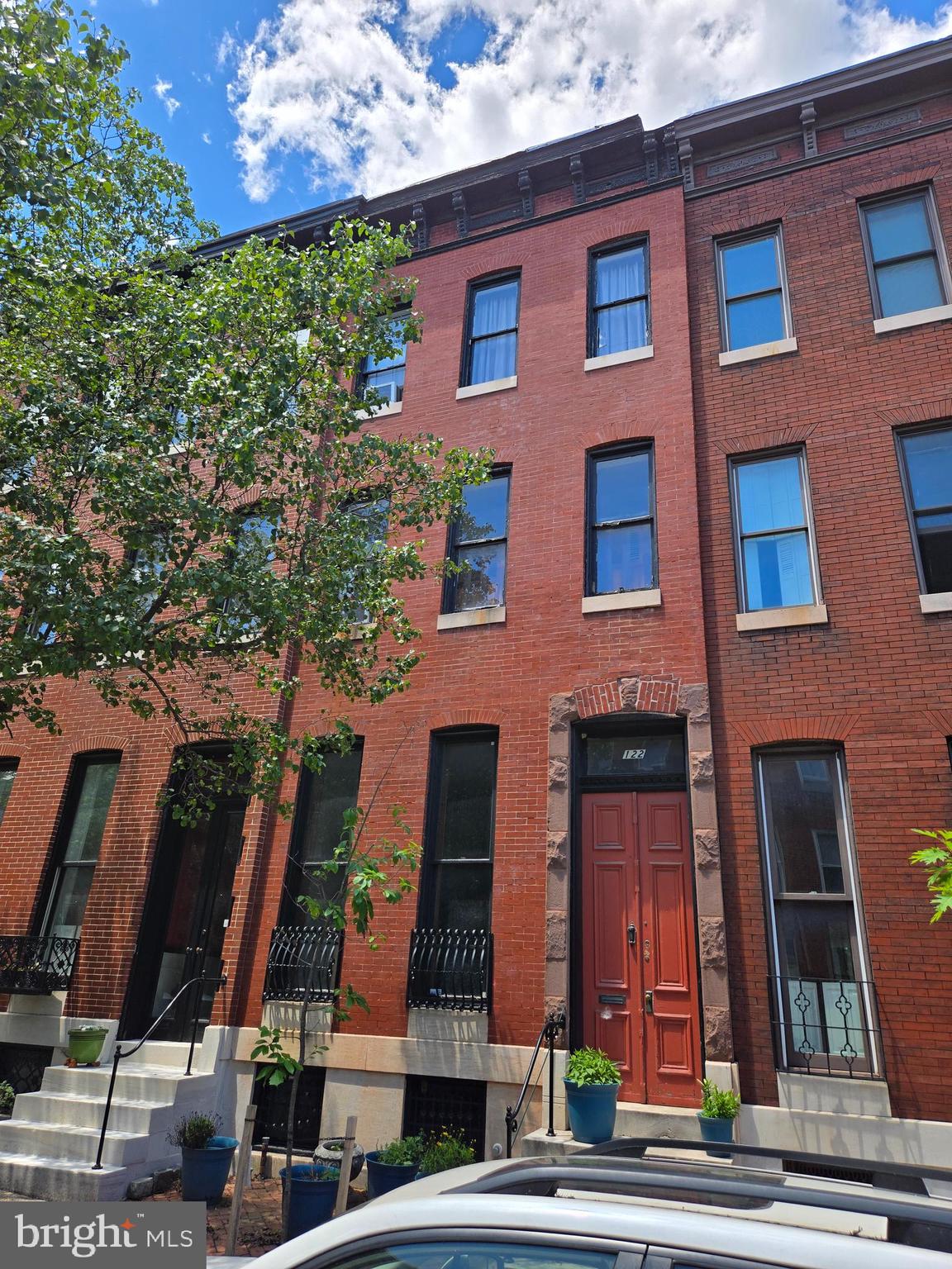 Welcome to 122 W. Lanvale Street. Located on one of Bolton Hill's most picturesque blocks and in one of Baltimore City's most sought out and architecturally significant neighborhoods.  This 19th century grand  home retains an impressive collection of original architectural details, beginning with a French door entry that leads to an impressive living area with tall ceilings, proportionally large crown moldings, original wood floors, an elegant chandelier that's surrounded by an equally elegant original plaster medallion appropriately centered on a marble fireplace crowned with an equally wide gilded mirror. From the well preserved original grand staircase, to the main level's soaring heavy original doors as well as the multiple varying carved stone fireplace mantels, the home's vintage appeal is consistent and primed for the architectural purist that is looking to start an extraordinary historic renovation that will bring 122 W Lanvale Street back to its well deserved timeless elegance. The Historic Bolton Hill lifestyle combines a quite residential neighborhood with access to multiple culinary and art driven venues, within an easy and pleasant walking distance. Note: Price reflects property's condition. Sold strictly as-is to include all contents.