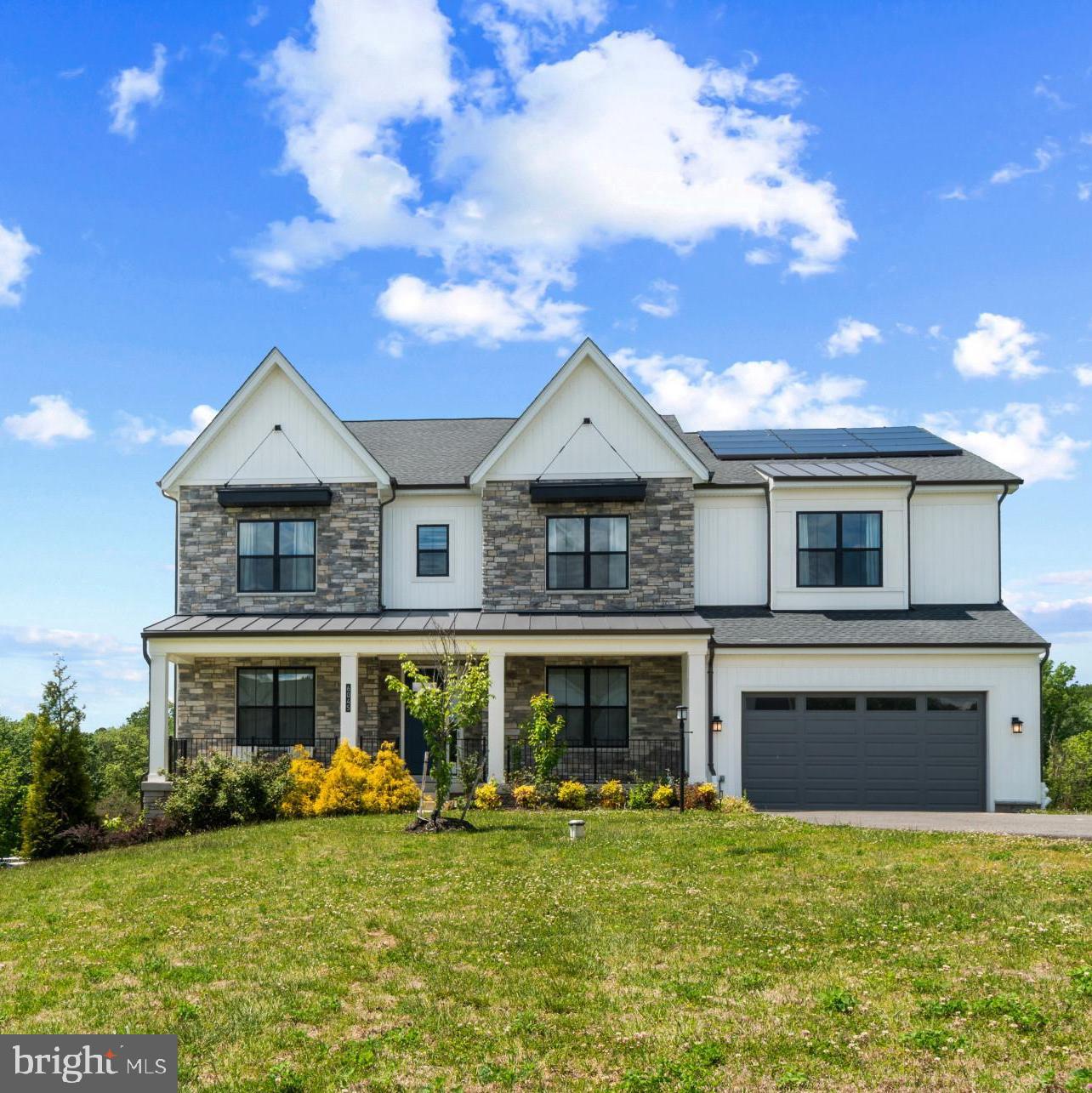 Welcome to 6045 Bricker  — an exceptional luxury residence (A Toll Brothers Community)  nestled on 1.12 private acres in the heart of the highly sought-after Dayton area, offering the perfect balance of elegance, comfort, privacy, and modern efficiency. This beautifully appointed four-year-old home presents a rare lifestyle opportunity in one of Howard County’s most desirable settings.

Thoughtfully designed for both everyday living and upscale entertaining, the home features expansive living spaces filled with abundant natural light, a stunning chef’s kitchen crafted for gathering and entertaining, and seamless indoor-outdoor flow throughout. The luxurious primary suite serves as a private retreat, complete with a spa-inspired bath featuring a soaking tub, dual vanities, and a spacious walk-in closet. Additional bedrooms offer en-suite bathrooms, providing comfort and privacy for family and guests alike.

Modern enhancements include solar panels that promote energy efficiency, reduce utility costs, and support long-term sustainability. The serene setting creates a true retreat atmosphere while remaining conveniently located near major commuter routes to both Baltimore and Washington, D.C.

Ideally situated close to the Triadelphia Reservoir and surrounding recreational areas, residents can enjoy scenic trails, kayaking, fishing, and outdoor leisure just minutes from home. Set within a premier school district and surrounded by mature landscaping, this exceptional property combines timeless sophistication, modern amenities, privacy, and enduring value — ideal for elevated everyday living.