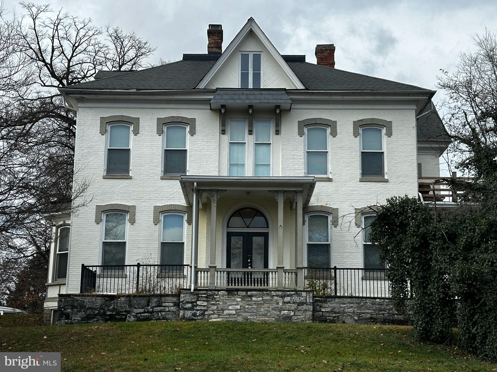 In accordance with the seller's requirements, we will not schedule any showings without receiving proof of funds or a bank pre-approval letter. Strong potential for both cash flow and appreciation. This stunning 5 Unit property offers over 4,600 square feet of space, featuring a beautifully constructed all-brick two-story building with four apartment units, plus a charming carriage house located at the rear. Nestled on a generous 3/4 acre lot, the property boasts ample parking space for tenants and guests.

 
Stable Rental History, a testament to its desirability and prime location.
Thoughtful Renovations, Recent upgrades seamlessly blend modern conveniences with the building's traditional charm, enhancing its appeal and functionality. The Apartment Details: 
-Main Building:
  -Unit 1: Spacious ground floor apartment with 2 bedrooms and 2 bathrooms.
  -Unit 2: Cozy 1 bedroom, 1 bathroom unit on the ground floor.
  -Unit 3: Beautifully renovated 1 bedroom, 1 bathroom unit, featuring a unique roof deck.
  -Unit 4: Comfortable 1 bedroom, 1 bathroom apartment.
-Carriage House: Delightful 2 bedroom unit with a Jack and Jill bathroom, offering additional privacy and space. This property is a rare find, perfect for investors seeking a blend of historical charm and modern living.