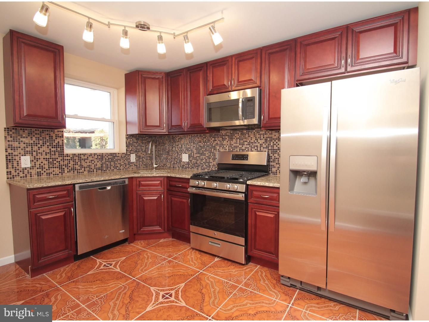 WOW! Unlike any other home on the market, this Overbrook property is truly a must see! Located on a beautiful quiet block with every extra you can imagine! The home has undergone a complete renovation inside and out! All new windows have been added and all new mechanicals have been installed to include (HVAC, Electric, Plumbing). The first floor features an open floor plan with a large living and dining area. There is also a powder room on the 1st floor for convenience. A new kitchen has been added to include all new appliances and tile throughout! In the kitchen you will find gorgeous 42' cabinets, which lead to a quaint deck and yard, perfect for entertaining! Upstairs there are 3 bedrooms and a spa bath straight out of a magazine! Other key features include a full finished basement with its own powder room, central air and many more upgrades throughout!