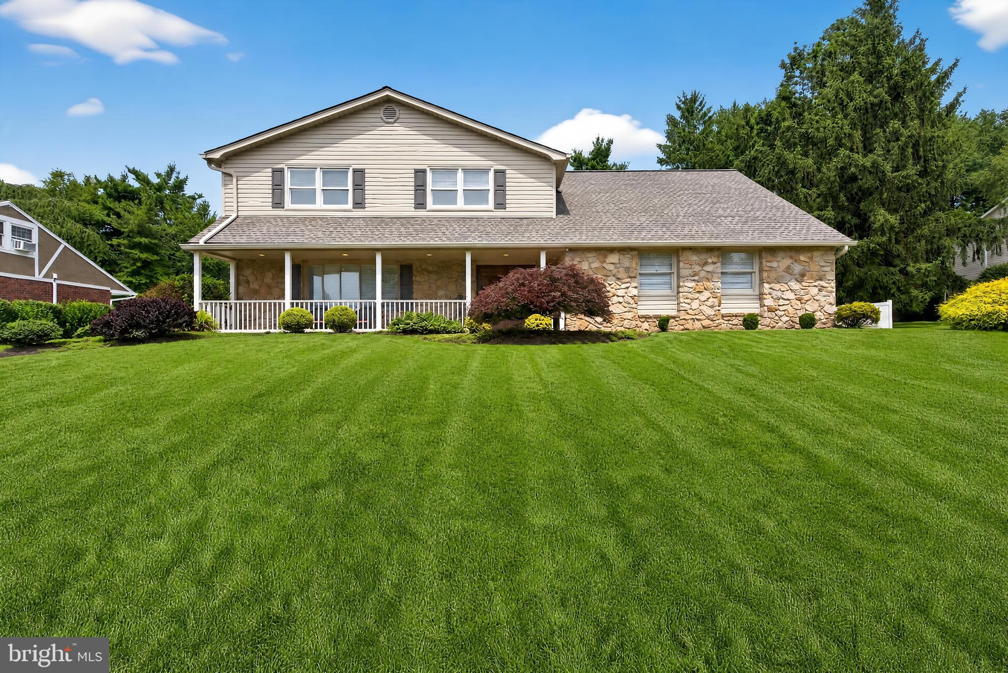 Welcome to this beautifully maintained home on a quiet street in the award-winning Lower Moreland School District. Set on a beautifully landscaped lot with mature trees and a private backyard, this spacious home offers a wonderful combination of classic charm, thoughtful updates, and functional living spaces. Upon entering, you are greeted by a dramatic two-story foyer with a curved staircase creating a welcoming first impression. The formal living room features a stone electric fireplace, recessed lighting, crown moulding, and shadow box moulding, providing an elegant space for entertaining. The flexible floor plan includes a first-floor office or optional fifth bedroom, a powder room, and a convenient laundry/mud room with access to the attached two-car garage, offering versatility for a variety of living needs. The family room offers a comfortable gathering area with views of the private backyard, complete with a stamped concrete patio, EP Henry retaining wall, and vinyl privacy fence—ideal for relaxing and outdoor entertaining. Upstairs, a wide landing and hallway enhance the sense of space and flow. The spacious primary suite offers a walk-in closet, additional closet space, a dressing area, and a private bath. Three additional generously sized bedrooms provide ample closet space and share a hall bath with double vanities. Additional improvements include a fully finished basement (not included in square footage), new HVAC system (2024) & upgraded electrical service. Conveniently located near parks, shopping, dining, and major commuting routes, this move-in ready home offers an exceptional opportunity in one of Montgomery County's most desirable neighborhoods.