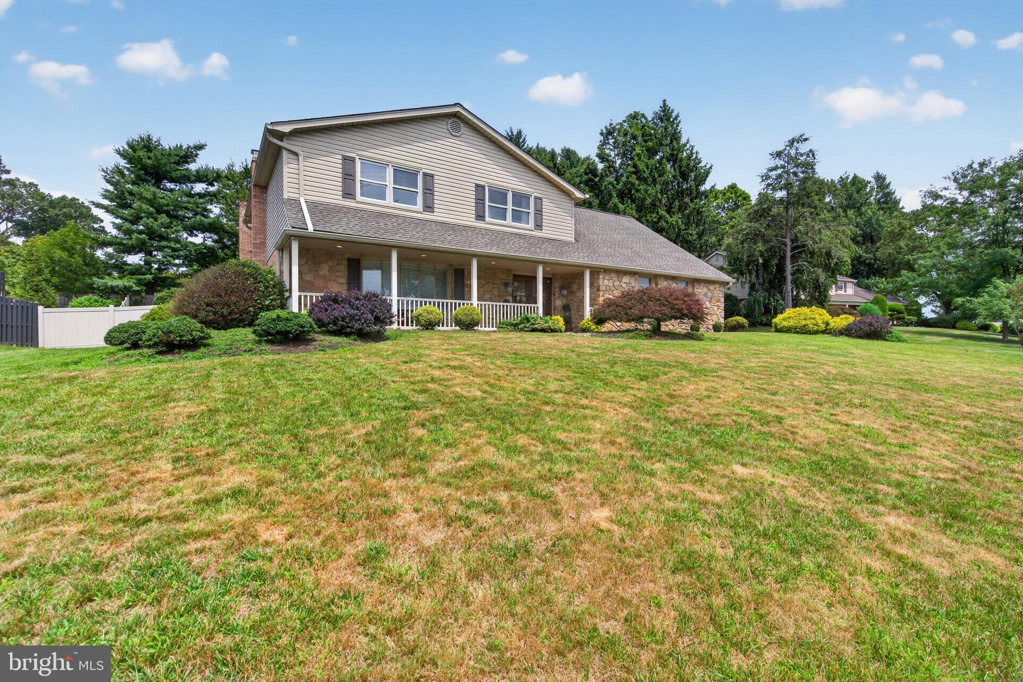 Welcome to this beautifully maintained home on a quiet street in the award-winning Lower Moreland School District. Set on a beautifully landscaped lot with mature trees and a private backyard, this spacious home offers a wonderful combination of classic charm, thoughtful updates, and functional living spaces. Upon entering, you are greeted by a dramatic two-story foyer with a curved staircase creating a welcoming first impression. The formal living room features a stone electric fireplace, recessed lighting, crown moulding, and shadow box moulding, providing an elegant space for entertaining. The flexible floor plan includes a first-floor office or optional fifth bedroom, a powder room, and a convenient laundry/mud room with access to the attached two-car garage, offering versatility for a variety of living needs. The family room offers a comfortable gathering area with views of the private backyard, complete with a stamped concrete patio, EP Henry retaining wall, and vinyl privacy fence—ideal for relaxing and outdoor entertaining. Upstairs, a wide landing and hallway enhance the sense of space and flow. The spacious primary suite offers a walk-in closet, additional closet space, a dressing area, and a private bath. Three additional generously sized bedrooms provide ample closet space and share a hall bath with double vanities. Additional improvements include a fully finished basement (not included in square footage), new HVAC system (2024) & upgraded electrical service. Conveniently located near parks, shopping, dining, and major commuting routes, this move-in ready home offers an exceptional opportunity in one of Montgomery County's most desirable neighborhoods.