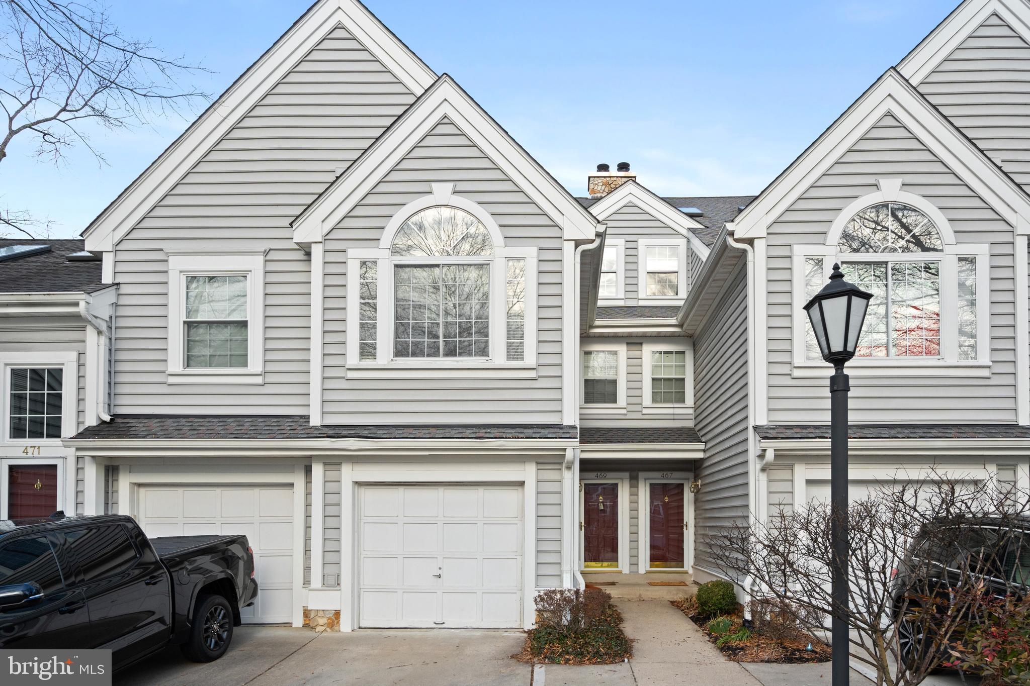 Located in the heart of historic Occoquan, this inviting townhome offers a blend of charm and modern convenience. The main level features an open living area with a two-story living room, a cozy wood-burning fireplace, cathedral ceilings, and skylights that bring in plenty of natural light. The eat-in kitchen on the main level provides a comfortable space for casual meals and gatherings. Step outside onto the deck to enjoy peaceful views of the surrounding nature. Upstairs, the primary suite includes a relaxing soaking tub and his-and-her walk-in closets, creating a comfortable retreat. An additional bedroom suite and a loft with a second wood-burning fireplace provide flexible space for relaxation or entertainment. The ground level offers a large utility room with a full-sized washer and dryer, extra room for storage, and access to the one-car garage for added convenience. With an additional driveway spot, parking is simple and easy. Just minutes from I-95 and Route 123, this home is close to all that Occoquan’s waterfront community has to offer. Don’t miss this opportunity!