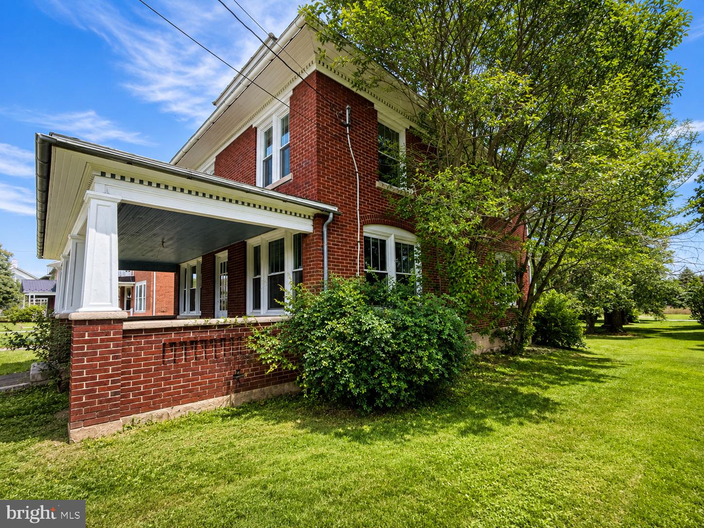 **OPEN HOUSE** Saturday(7/25) 10:30-12PM Fall in love with this beautifully maintained 1900’s brick home offering over 1,900 square feet of living space, perfectly designed for comfort and everyday living. This inviting property features 3 spacious bedrooms and 2 bathrooms (1 full and 1 half), making it an ideal fit for families or anyone looking for room to grow. Step inside and enjoy the charm of original maple hardwood floors flowing throughout the downstairs of the home and original pine flooring upstairs. There is a top-of-the-line kitchen that has granite countertops as well as custom made cabinetry. This beautifully upgraded kitchen is both stylish and functional — perfect for cooking, entertaining, and gathering with family and friends. There are 2 sets of pocket doors downstairs to allow for an open living concept or the ability to separate rooms. There is a new washer and dryer on the first floor as well. In addition to the living areas there is a full walk-up attic and a full basement. One of the home’s most charming features is the four covered porches, offering multiple spaces to relax and enjoy the outdoors. Upstairs features two covered porches, including a “sleeping porch” off the master suite, perfect for enjoying quiet mornings or cool summer evenings. The home has been thoughtfully updated with new windows throughout, bringing in plenty of natural light while improving energy efficiency. Outside, you’ll find a huge backyard offering endless possibilities for outdoor entertaining, gardening, or simply relaxing in your own private space. The lot on the west side of the home is deeded separately and is included in the current purchase price of the home. The property also includes an oversized garage, providing excellent storage, workspace, or room for multiple vehicles. Well cared for and move-in ready, this home blends character, modern updates, and generous space both inside and out. Homes offering this much space, charm, and outdoor living rarely come available — schedule your private showing today.