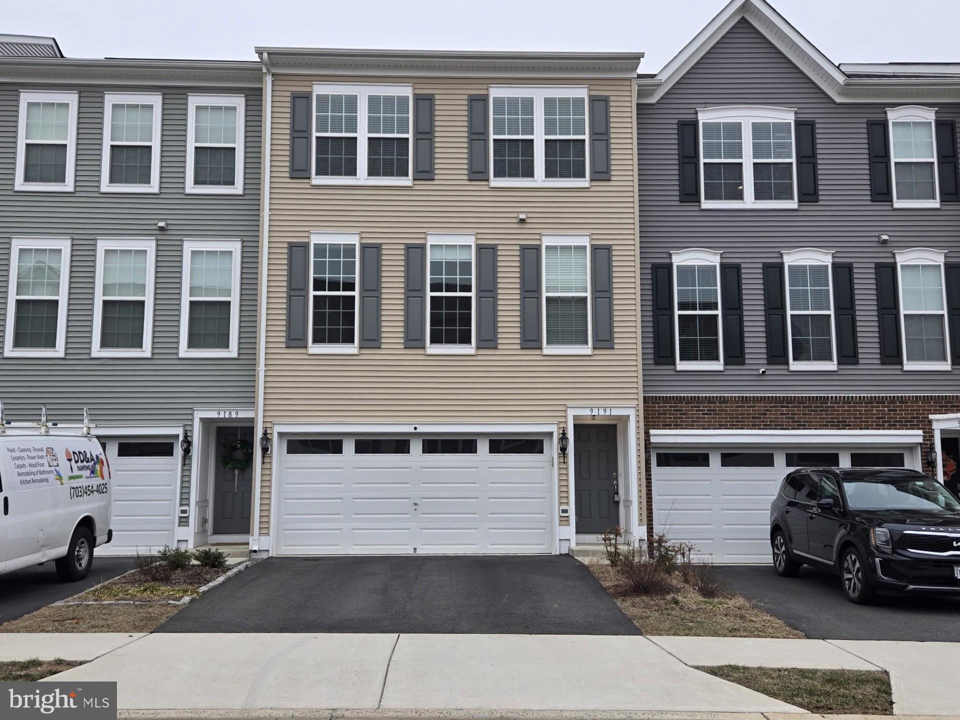 Welcome to this stunning townhome, offering nearly 2,600 sq. ft. of living space in the highly sought-after Richmond Station community. The main level boasts a bright and open layout featuring a spacious family room, a dining area, and a modern kitchen with granite countertops, stainless steel appliances, recessed lighting, a generous island, and a convenient half bath. A sliding glass door leads to a large composite deck, perfect for outdoor enjoyment.

Upstairs, you'll find three well-appointed bedrooms, including a luxurious primary suite with a walk-in closet and two full bathrooms. The lower level features a cozy den, ideal for a home office, exercise room, or reading nook, with direct access to a private, fenced backyard. This level also provides entry to a two-car garage and a driveway.

Conveniently located near shopping, dining, and major routes—including Liberia Avenue, Route 28, Prince William County Parkway, and Route 66—this home is less than a mile from the Manassas Park VRE station, ensuring easy commuting.