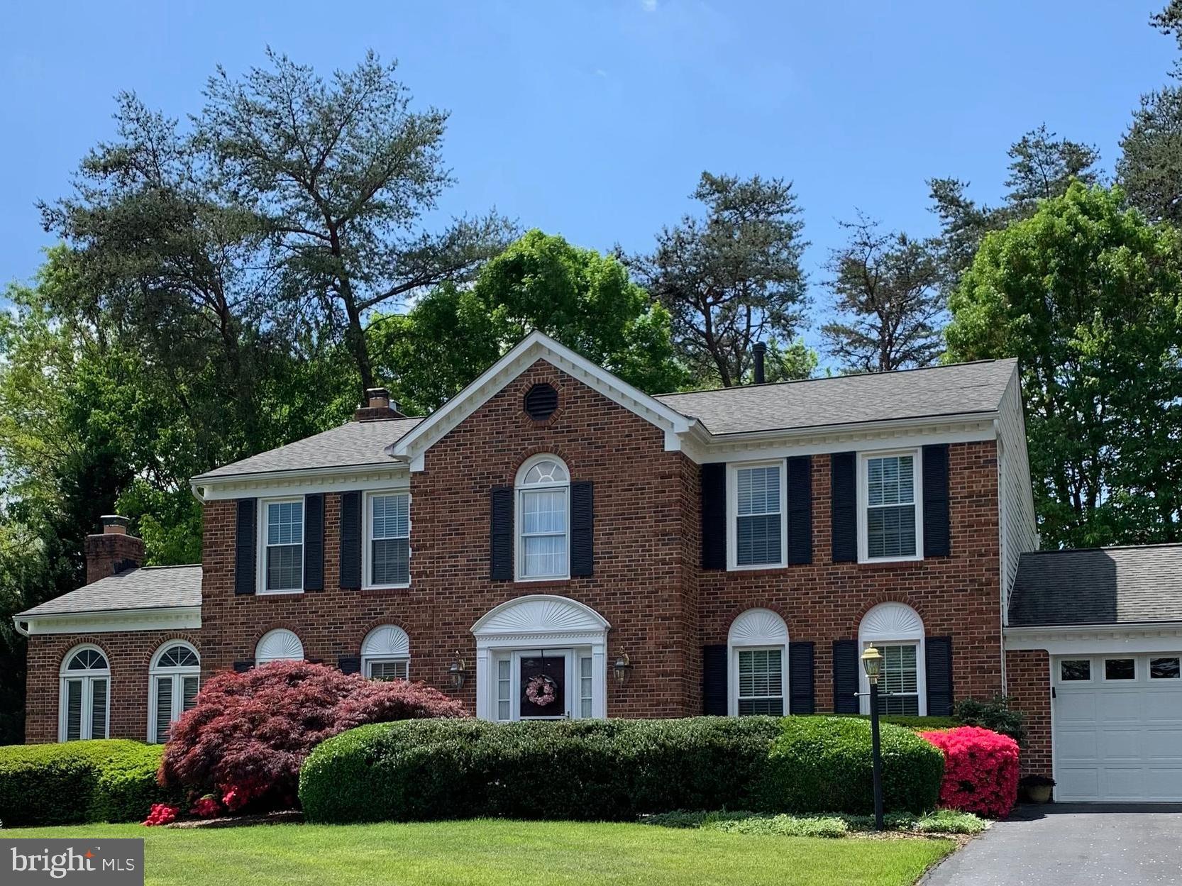 Welcome to this stately brick-front colonial in the highly sought-after Virginia Run community. Offering over 4,500 finished square feet, 4 bedrooms, 3 full baths, and 1 half bath, this impeccably maintained home combines timeless elegance with exceptional living space.

A dramatic two-story foyer and graceful curved staircase create a stunning first impression, while spacious formal and casual living areas provide the perfect setting for both everyday living and entertaining. With three fireplaces—including two wood-burning fireplaces and one gas fireplace—the home offers warmth, charm, and inviting gathering spaces throughout.

The fully finished walkout basement provides abundant additional living space, ideal for recreation, hobbies, a home office, or guest accommodations.

Situated on a beautifully landscaped and fully fenced one-third acre lot, the outdoor spaces are equally impressive. Enjoy relaxing or entertaining on the spacious deck with built-in planters, while the charming playhouse offers endless fun for younger residents and visitors alike. Tucked away on a quiet cul-de-sac, the property offers both privacy and a welcoming neighborhood setting.

Residents of Virginia Run enjoy outstanding community amenities, including a pool with summer swim team, tennis and pickleball courts, basketball courts, playgrounds, walking trails, and year-round community events. Conveniently located near Routes 66 and 28, this home offers easy access to major commuter routes, shopping, dining, and all that Northern Virginia has to offer.

Lovingly maintained and beautifully presented, this exceptional home is ready for its next chapter.