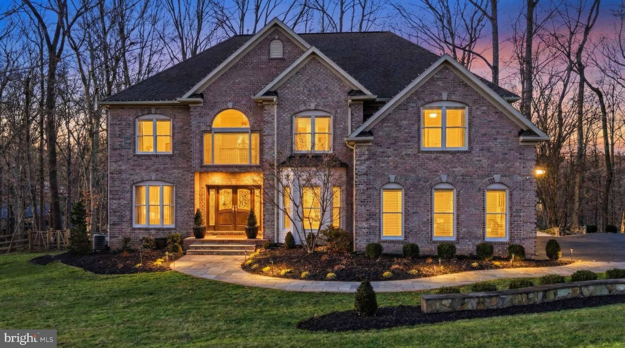 ***Price Improvement!***

Welcome to this remarkable custom-built colonial home nestled on over an acre of beautifully landscaped grounds in the exclusive Patapsco Park Estates community of Ellicott City. Offering more than 5,600 square feet of finished living space, this home showcases exquisite craftsmanship, timeless design, and luxurious modern comforts. Step inside to find 6 plus spacious bedrooms, 5 bathrooms, 3 car garage and impeccable finishes throughout. The gourmet kitchen is designed for both everyday living and entertaining, featuring professional-grade appliances, granite countertops, and rich custom cabinetry. The family room with coffered ceilings and a wood-burning fireplace flows seamlessly to the outdoor living spaces. The luxurious primary suite is a true retreat, complete with a private balcony overlooking the serene backyard, a spa-inspired bath and dual custom walk-in closets. The fully finished lower level offers additional space for relaxation or entertainment, including a guest suite with a full bathroom, media room, wine cellar, home gym, gas fireplace and custom built-ins. Enjoy the outdoors from the expansive composite decking, custom stone patio, indoor/outdoor stereo system and grill area, surrounded by mature trees for privacy. Located in the highly sought-after Mt. Hebron area of Howard County, this home offers the perfect blend of luxury, privacy, and convenience—just a short walk to Patapsco State Park and close to major commuter routes, shopping, and top-rated schools. Meticulously maintained and thoughtfully designed, this home is ideal for those seeking refined living in a peaceful setting. Conveniently located between Baltimore and DC, this residence is a centrally located, commuter-friendly suburb. Don't miss your chance to tour this magnificent home and make it yours. Schedule your appointment today!