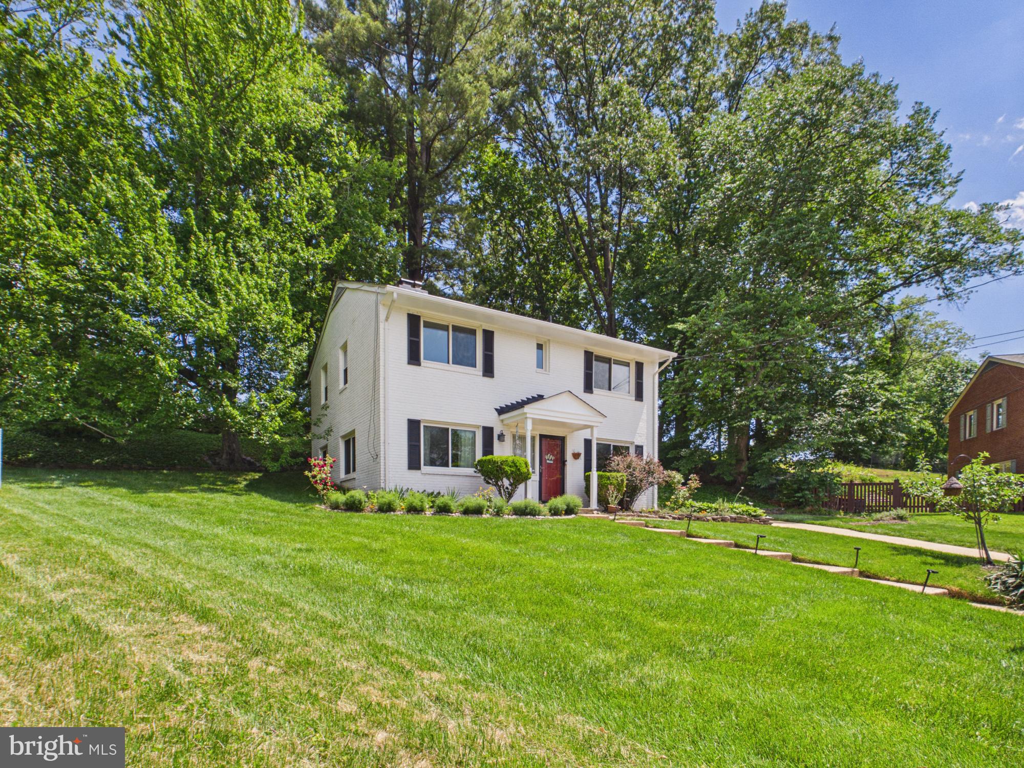 Tucked on a quiet cul-de-sac in Springfield, this beautifully maintained brick home blends timeless character with meaningful updates and an incredible connection to nature. The bright and spacious main living area features oversized windows, a wood-burning fireplace, and a layout that feels both open and welcoming. The renovated kitchen offers white cabinetry, granite countertops, stainless steel appliances, gas cooking, stylish backsplash details, and a breakfast bar that flows naturally into the dining area — creating a space that feels practical for everyday living and easy for entertaining.
Beyond the interior, this property has a setting that is hard to replicate. The screened porch with skylights overlooks a peaceful, tree-filled backyard with mature landscaping, terraced hardscaping, winding pathways, and usable outdoor space rarely found in this part of Springfield. Whether enjoying coffee on the porch, hosting friends outside, or simply appreciating the privacy and greenery, the home feels like a retreat tucked into the neighborhood. The elevated lot and cul-de-sac location add to the sense of quiet and separation from the everyday rush.
The owners have invested consistently in the home over the years, reflecting true pride of ownership. Major improvements include replacement windows with transferable lifetime warranty (2007), gutters (2014), renovated baths (2016 & 2018), renovated kitchen and appliances (2022), exterior sewer line replacement (2022), washer/dryer (2022), HVAC replacement (2023), roof shingles (2024), and attic foam insulation creating a conditioned attic space (2025). This is the kind of home buyers notice — not because everything screams “new,” but because the care, maintenance, and thoughtful improvements have been consistently made over time.
Conveniently located in the heart of Springfield, 5512 Kathleen Place offers the rare combination of a quiet residential cul-de-sac setting with outstanding access to daily conveniences, commuter routes, parks, and shopping. Within approximately 1 mile, you’ll find neighborhood parks, local schools, grocery options, dining, and easy access to Braddock Road and Backlick Road. Just a few miles away are the Springfield Town Center, Trader Joe’s, Whole Foods, Target, Costco, and countless restaurants and retail options that make everyday errands simple and convenient.
For commuters, the inside the beltway location is especially strong — with quick access to I-495, I-395, and I-95, along with nearby Franconia-Springfield Metro/VRE and commuter bus options for travel into Washington, DC, the Pentagon, Fort Belvoir, and surrounding Northern Virginia employment centers. Within roughly 5-10 miles, residents can also enjoy Lake Accotink Park, Wakefield Park trails and recreation, Mosaic District shopping and dining, Tysons, Old Town Alexandria, and more. It’s the kind of location where you can feel tucked away at home, yet still remain remarkably connected to everything Northern Virginia has to offer.