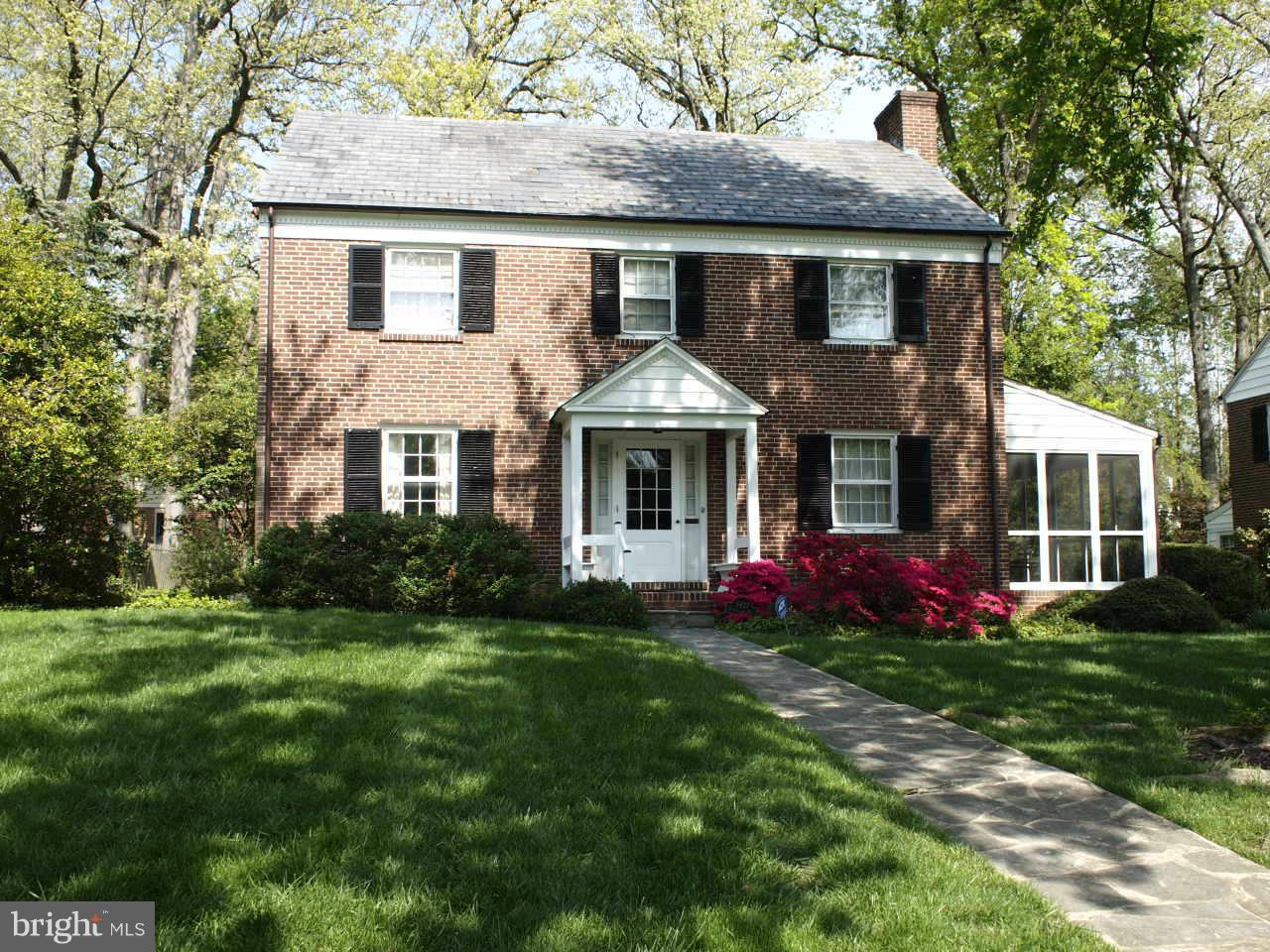 Best price in Homeland! Classic brick center hall Colonial! 3 Bedrooms + den. 2 1/2 baths. Walk-up attic for possible extra room.  Wood floors in LR, DR, stairs, hallways, den, bedrooms. Living room with FP. Screened porch. Very deep yard with 2 car garage. Updated furnace and A/C (2011). Slate roof. House has been well maintained; priced to reflect needed updates.