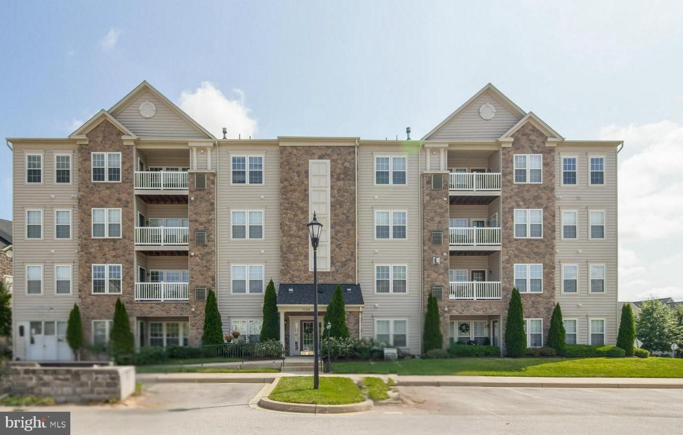 2 Bedrooms | 2 Baths | 55+ Elevator Building | Golf Course Community | 2nd  Floor

FRESH START! Rarely available second floor, east‑facing 2 bedroom / 2 bath condo in the highly sought‑after Courtyards of Waverly Woods 55+ community. This sun‑filled home offers high ceilings, a gorgeous stone gas fireplace, and an open, airy layout that lives large and bright from morning to sunset.

The sprawling kitchen features abundant cabinetry, granite counters, a full-size laundry closet, and plenty of space for cooking, gathering, and everyday ease. The primary suite includes a walk‑in closets and a private bath, while the spacious second bedroom offers its own dual‑entry bath—perfect for guests or flexible use.

Enjoy peaceful east‑facing views, elevator convenience, and the comfort of living in one of Howard County’s most desirable golf course communities. Waverly Woods residents enjoy access to pool, tennis, fitness, walking paths, clubhouse, and beautifully maintained grounds.

All of this just minutes to I‑70, shopping, dining, and everyday conveniences.

A rare opportunity to enjoy low‑maintenance living in a vibrant, amenity‑rich 55+ neighborhood.