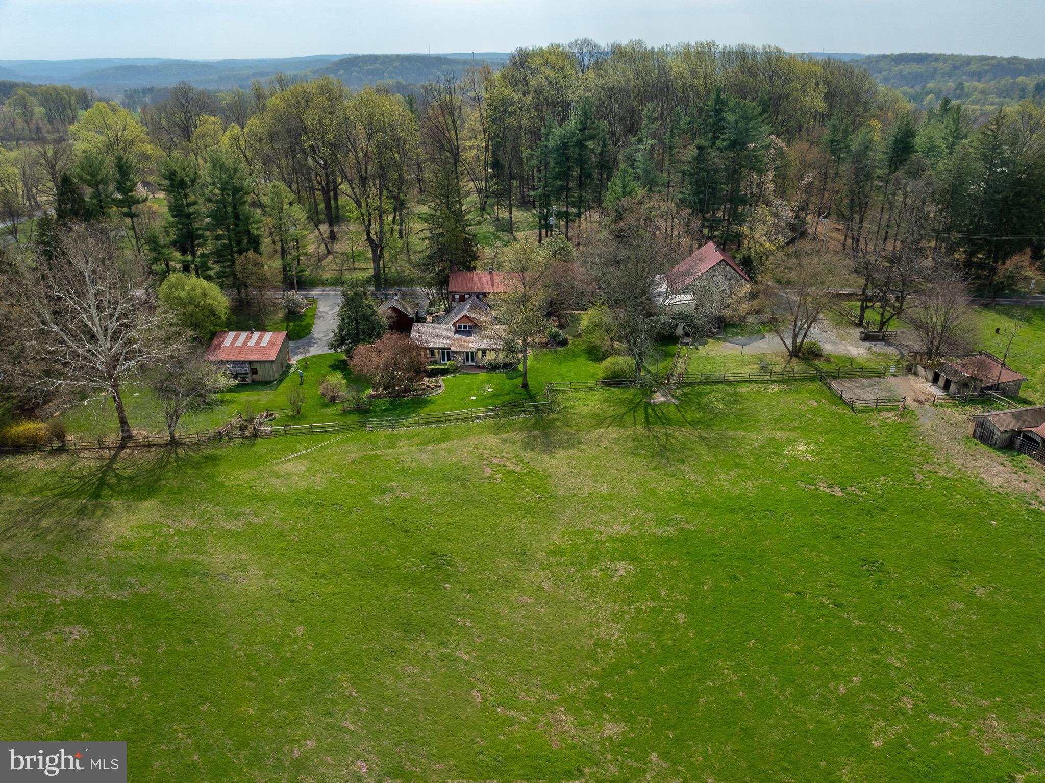 Colonial charm meets timeless character in Chester Springs at Saint Matthews Place farm! Located at 1169 Saint Matthews Road in West Vincent Township, this one-of-a-kind historic home dates back to the 18th century and beautifully blends its original architecture with thoughtful additions completed in 1980 and the 2010. Set on 5 acres,  the 3,614 square foot  home features a front sitting patio and a large enclosed brick patio overlooking the backyard and pastures—perfect for entertaining and tranquility. The home offers 3 bedrooms, 3 full baths, and 2 half baths, with both levels showcasing distinctive architectural character enhanced by hardwood and tile flooring throughout. A bright sunroom with floor-to-ceiling windows/sliding doors and a classic brick floor overlooks picturesque scenery. A spiral staircase leads to a loft featuring a striking floor-to-ceiling built-in bookcase. All three bedrooms include ensuite bathrooms—the loft offers a half bath, while the remaining two feature full baths. A third full bath is on the main level off the living room, complete with a standing shower and separate bathtub with a tub rail. The home also includes convenient laundry on both the main level and in the basement.

Equestrian enthusiasts will appreciate the impressive outdoor amenities, including a large bank barn, built with local stone that features 10 stalls, a tack room, a blanket room, a tool room, a half bath, and extensive upper-level storage for feed, farm equipment or carriages. The barn opens directly into the pasture (approximately 3.8 acres of open land), which features three run-in sheds and a feeding trough. The property also includes  a newer oversized three-car garage, along with two separate driveways—one serving the home and one the barn. This exceptional property offers timeless character, functional space, and a rare opportunity to own a piece of history.