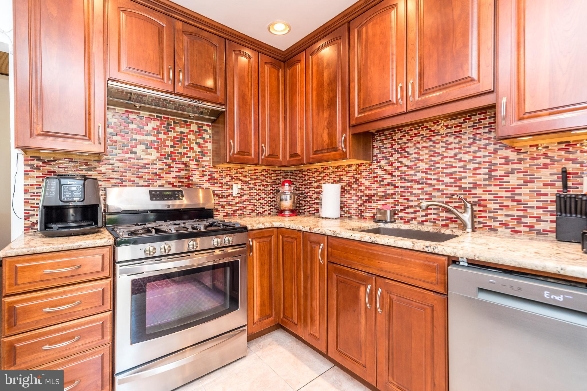 Welcome home to this wonderfully unique  split-level in Inglewood Gardens! Your arrival is greeted with a spacious driveway front steps that lead you to a large front paver patio and entrance way. Enter your new home and immediately be impressed the terrific great room with vaulted ceiling, exposed beams, upgraded flooring and light pouring in through a large wall of windows. The kitchen includes cherry cabinets with under cabinet lighting, high grade granite countertops,  appliances including gas range, dishwasher, refrigerator/freezer, glass tile backsplash, and recessed ceiling lighting. Pendant lights illuminate an extra large preparation area with even more cabinets for family gatherings. The sliding door leads to the huge deck that continues onto an extended oversized paver patio and above ground pool. The lower level family room has  porcelain tile floor with a walkout to the rear oversized paver patio. and pool. A laundry room, powder room and garage complete this lower level. Upstairs are three good sized bedrooms with cherry hardwood floors plus the remodeled hall bath . Other upgrades include new front door, and bonus space in the back yard. Great fenced back yard with huge deck. This is a terrific setting in a desirable neighborhood within easy walking or driving distance to schools, shopping, downtown Lansdale, and major commuting routes.