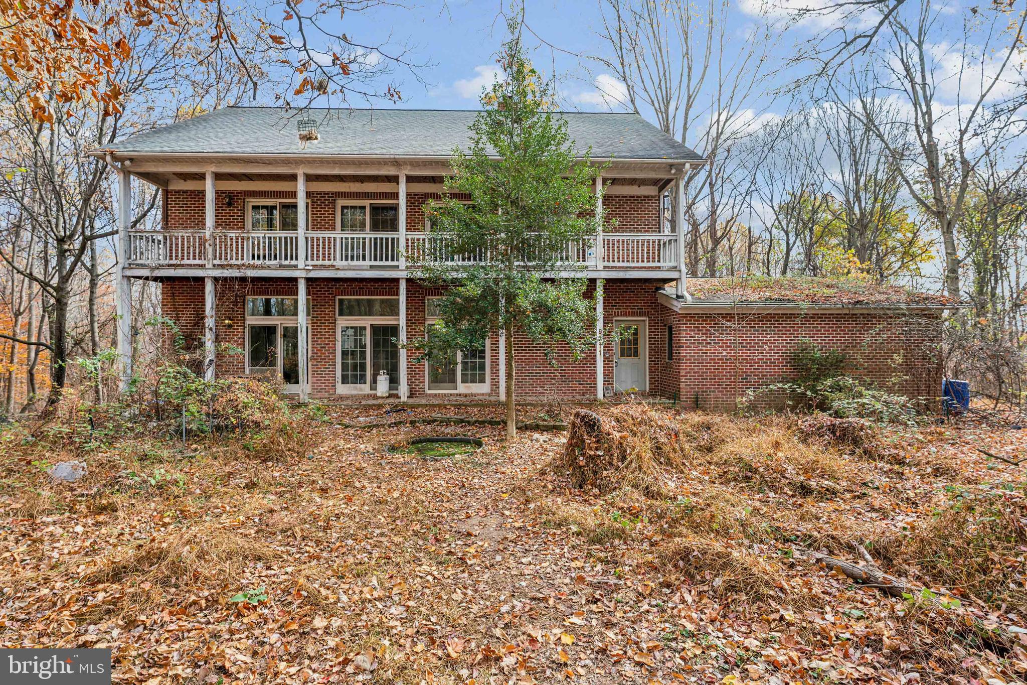 Seller is currently reviewing offers.
Private showings only - please schedule an appointment through your real estate agent or call listing agent.  

Opportunity knocks! This wooded, level 33.95 acre lot is your opportunity to enjoy wooded privacy and beauty in Montgomery County! The spacious two story brick house with walk-out basement was built in 1995. This property features hardwood floors, Andersen replacement windows (with gorgeous views from all!), steel exterior doors, asphalt shingle roof, aluminum gutters and downspouts, solar panels on roof, heat pump, three (3) phase - 200 amp circuit breaker electrical service, two wood stoves, and a 3 car attached garage. Access the property via a .4 mile (+/-) shared "right-of-way" to Slate Quarry Road, leading to the circular driveway by the house.

A two-story barn is also located on property. Close to commuter routes but a world away from the hustle and bustle, this home is located close to both Sugarloaf Mountain and Little Bennett Regional Park. 

This is an estate sale. Recent appraisal shows comps of $1.2-$1.375 million. The house is solid but both it and the barn will need extensive work. This property is priced to reflect the work needed...put in the sweat equity and reap the rewards! Second floor of barn is off-limits, and most items currently on the property will convey with the sale (a few items will be removed prior to settlement). Some tree clearing and partial removal of household items has already taken place.