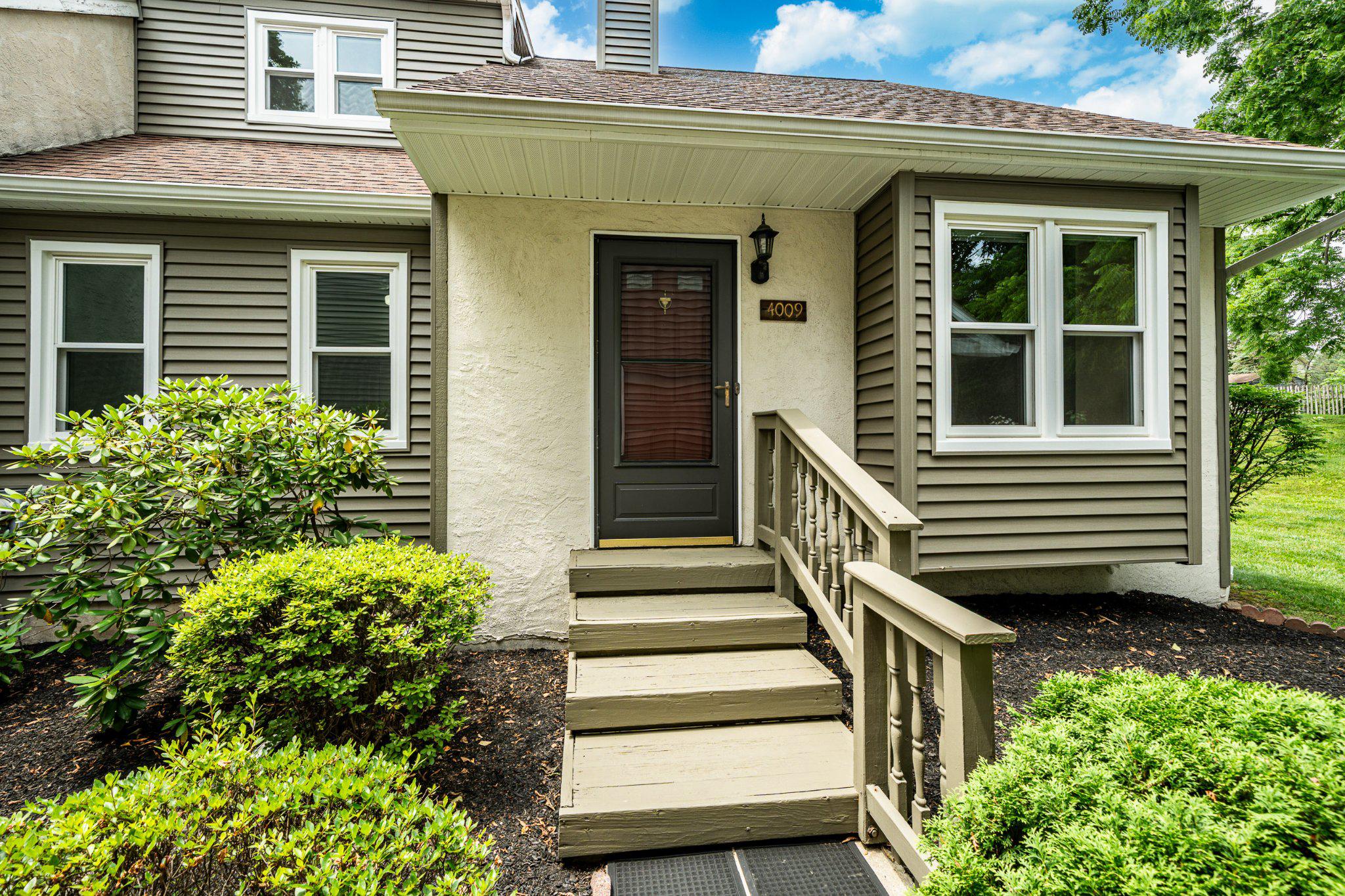 Welcome to 4009 Franklin Court - nestled in the charming Liongate community. This delightful end-of-row townhouse, sitting on a prime, private lot, offers a perfect blend of comfort and style. Step inside to discover an inviting interior that features an open floor plan that seamlessly connects the living and dining areas. The spacious living area is enhanced by a cozy wood burning fireplace, perfect for those chilly evenings. The combo dining area and kitchen with island is designed for both functionality and culinary creativity. From the kitchen you can easily access the rear deck inviting you to unwind and enjoy the serene views of the landscaped garden and surrounding trees. This corner lot adjoins open space, providing tranquility and privacy. There is the convenience of two bedrooms and a full bathroom on the main floor, making it ideal for anyone who wants to avoid stairs or gives you the versatility to adapt to your needs of a home office or quest room. Also, enjoy of ease of having laundry on this level, ensuring that chores are a breeze. Upstairs is an extremely large primary suite with vaulted ceilings, sky lights, a full bathroom, walk-in closet and newer carpeting. There is a full, unfinished basement, so storage space is never a concern. With community amenities like a pool, clubhouse, basketball court, playground and dog park, there's something for everyone to enjoy. This home combines privacy with accessibility with assigned parking and a prime corner lot located on a no-thru street. Award wining Downingtown area school district. Close to the Exton Mall, restaurants, SEPTA and major roadways. Walking distance to Milky Way Creamery, walking trails and a short drive to Marsh Creek Lake - offering ample outdoor activities. Recent upgrades include new windows, vinyl siding, capping, soffits and gutters (2024), hot water heater (2024), Lennox HVAC system (9 yrs old), painted exterior of home, and some Levelour thermal blinds. With many big-ticket item improvements already done, move in with peace of mind and slowly make this home your own! Experience the comfort and convenience of Liongate living - your new home awaits!