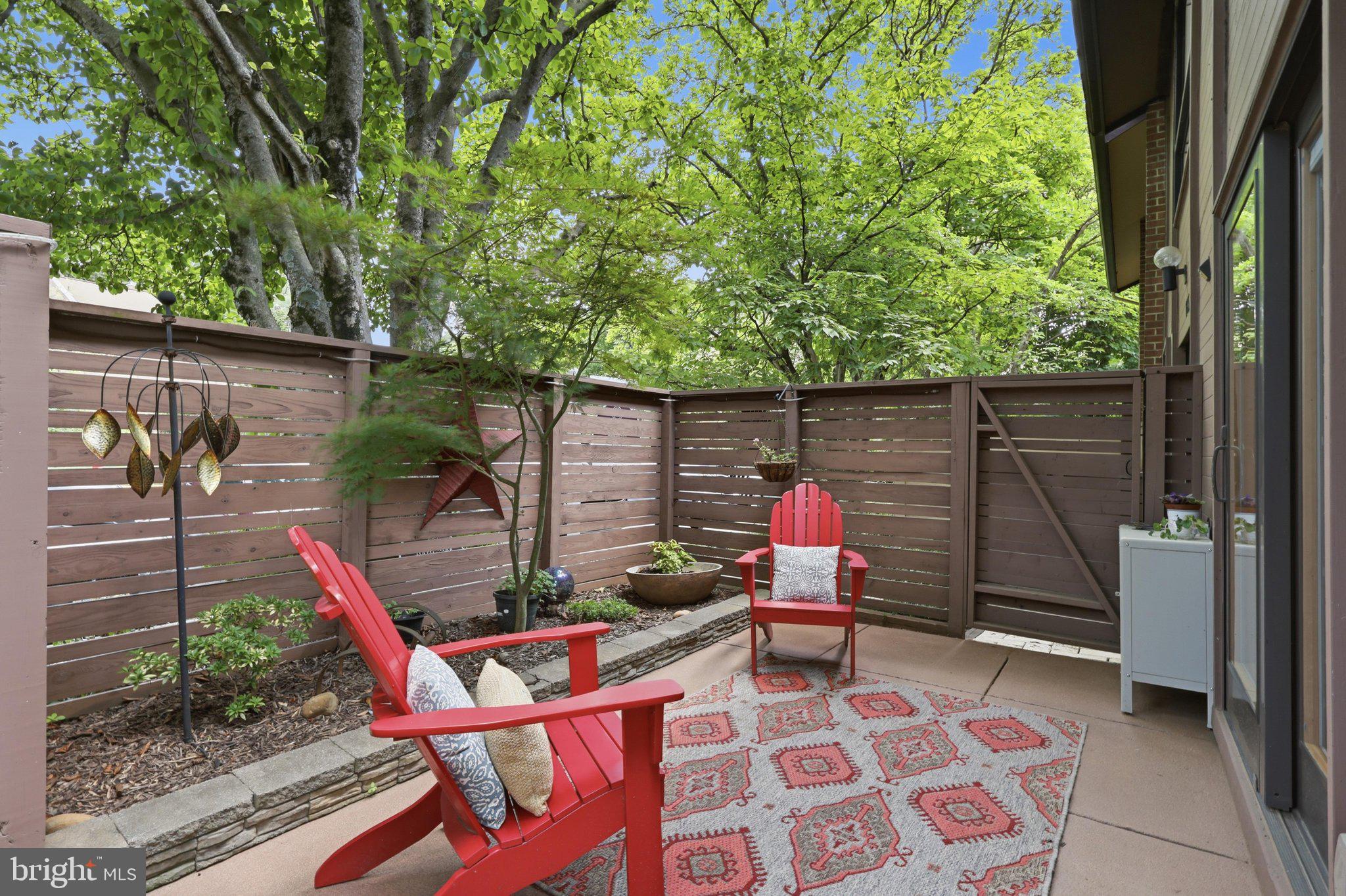 Surrounded by wooded green space with picturesque views of Reston National Golf Course, this beautifully updated contemporary end-unit townhome is tucked away in the highly sought-after Hunters Green Cluster. Offering 4 bedrooms, 2.5 bathrooms, and over 2,200 square feet of living space, this home truly lives like a single-family home, with exceptional indoor and outdoor spaces designed for relaxing, entertaining, and enjoying nature.
<br>
<br>
The renovated gourmet eat-in kitchen is sure to impress with stainless steel appliances, an induction cooktop, a lockable built-in Tittla beverage cooler, a Bosch refrigerator, a double oven, a built-in microwave, a double dishwasher, a gorgeous marble backsplash, Calcutta Gold quartz countertops, UltraCraft maple cabinets, updated lighting, and expansive counter space. Just off the kitchen, the separate dining room—currently used as the living room —opens through sliding glass doors to a private deck, the perfect spot for morning coffee while overlooking the trees and listening to the birds.
<br> 
<br>
The outdoor living spaces continue below with a spacious patio overlooking the golf course, a fenced yard, thoughtfully designed gardens, and a large secure outdoor storage area.  A walkway connects the backyard to the fenced front courtyard, creating multiple inviting spaces to enjoy the outdoors.
<br>
Inside, the main level features a convenient laundry/storage room, updated powder room, and an impressive sunken family room with soaring 13-foot ceilings, oversized windows, a wood-burning fireplace, and a sliding glass door leading to the back patio. Baseboard electric heaters with wall controls were also added for additional comfort.
<br>
<br>
Upstairs, the spacious primary suite offers a wall of windows framing peaceful wooded views, two closets, and an updated en-suite bathroom. Three additional generously sized bedrooms with large windows share a beautifully renovated hall bathroom. NO carpet!!!
<br>
<br>
Major updates include:  Roof (2023), HVAC (2022), Attic re-insulated (2020), Exterior painted (2021), Kitchen renovation (2025), Hall bathroom renovation (2025), Andersen sliding glass door (2019), Outdoor storage addition (2021)
<br>
<br>
As a Reston Association resident, you'll enjoy access to an exceptional collection of amenities, including 15 outdoor pools, 55 miles of paved and natural trails, 52 tennis courts, 18 pickleball courts, playgrounds, multipurpose courts, and countless recreational opportunities.
<br>
<br>
Ideally located near Reston Parkway, Fairfax County Parkway, the Dulles Toll Road, Silver Line Metro stations, and Dulles International Airport, this home also offers easy access to Reston's four lakes, the W&OD Trail, Reston Town Center's shops, restaurants, and entertainment, community festivals, Walker Nature Center, and Lake Newport's Lake House, Convenient to Wolf Trap, Capital One Hall, Great Falls Park, and Tysons Corner.
<br>
<br>
One assigned parking space conveys, with ample unassigned parking available for residents and guests.
<br>
VIDEO: https://iframe.videodelivery.net/77f38295e0e64f8fc14fe7b34e52f150