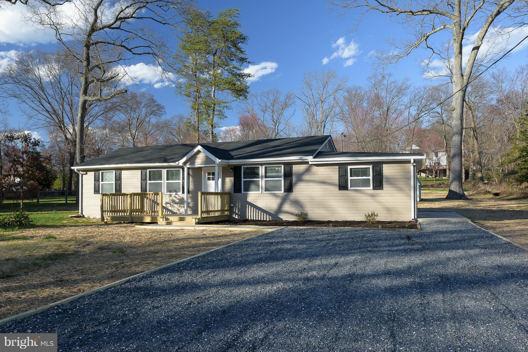 One level living at it's finest - Renovated from top to bottom! Located on an extra large lot (0.62 acre) with room the breathe! Large eat-in KIT w/ ceramic tile, granite counters, new cabinets, & SS apps! NEW roof, flooring, siding, windows, & deck! Gravel driveway can accommodate multiple vehicles! Chelsea Beach features boat ramp, playground & beach! Move right in!