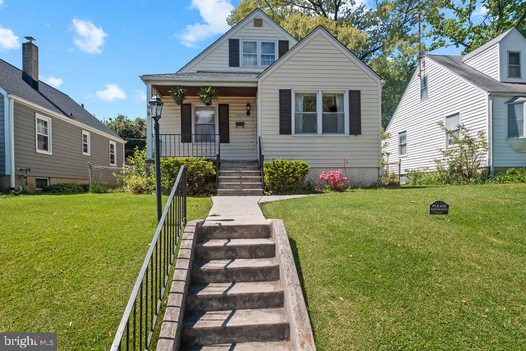 BEST AND FINAL OFFERS  BY MONDAY, MAY 4TH AT 6:00 PM.   Welcome to this Timeless Cape Cod style home where classic charm meets beautiful character.  This home is ready for your personal touch.  A functional layout boasts a spacious living room and dining room perfect for both everyday living and entertaining.  Hardwood floors have been covered with carpet for many years.   Two bedrooms on the main and an additional bedroom upstairs with an abundance of storage and built-ins.  The lower level  features a recreation room, bar area, laundry room, workshop space, half bath, and more.  It is partially finished with a lifetime waterproofing certificate.  Brand new Hot Water Heater.  Quiet neighborhood at the intersection of a one way street makes it easy to  relax on the front porch or retreat to the back deck with a  fenced yard.  An abundance of neighboring county green space within steps.  Location is the key!  Super close to 695, grocery stores, schools, and a variety of shopping and restaurant options.  Being Sold AS-IS.  A  Home with timeless appeal!  Come make it your own.