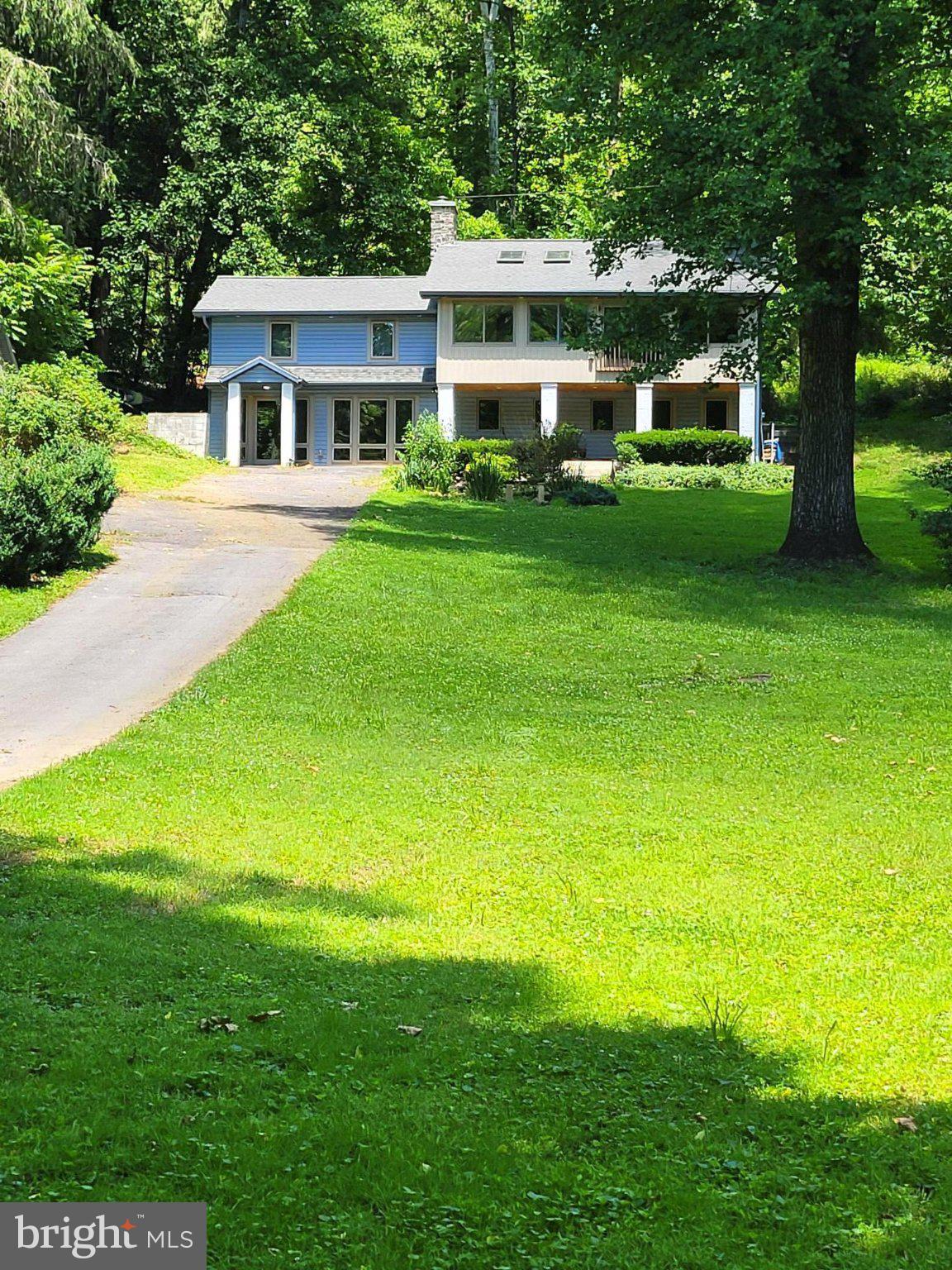 Nestled on a serene 3.1-acre lot, this exquisite raised ranch home offers a perfect blend of comfort in a picturesque rural setting. The property boasts a traditional floor plan enhanced by exposed beams, wide plank wood flooring and abundant natural light from skylights, creating an inviting atmosphere throughout. The heart of the home features a charming country kitchen equipped with stainless steel appliances, an island for casual dining, and recessed lighting that sets the mood for culinary creativity. With three bedrooms and two full bathrooms this residence is designed for both relaxation and functionality. The fully finished daylight basement provides additional living space, ideal for entertaining or as a cozy retreat, complete with walkout access to the lush surroundings. Step outside to discover the enchanting outdoor features, including a shaded front porch perfect for morning coffee and an outbuilding for extra storage or hobbies. The property backs to trees, offering a sense of privacy and tranquility, while the scenic views of the mountains and river create a breathtaking backdrop. Conveniently located in a rural area yet easily accessible, this home provides ample parking with a paved driveway accommodating up to 15 vehicles. Experience the exclusive lifestyle this property offers with panoramic views, and every day feels like a getaway.  Only steps away from the Potomac River shoreline boat ramp as well as the scenic C & O Canal.  Enjoy water skiing, hiking & fishing with a wide variety of fish including Small & Large Mouth Bass, & Striped Bass making it a year round fishing destination.  Seller recently installed a new well in the Spring of 2026 with a depth of about 285 feet which generates approximately 20 Gallons Per Minute.  Flood Insurance is not required per the seller.  The propane furnace is only about 3 years old and the newer Hearth Stone Heritage Wood Stove will convey per the seller.