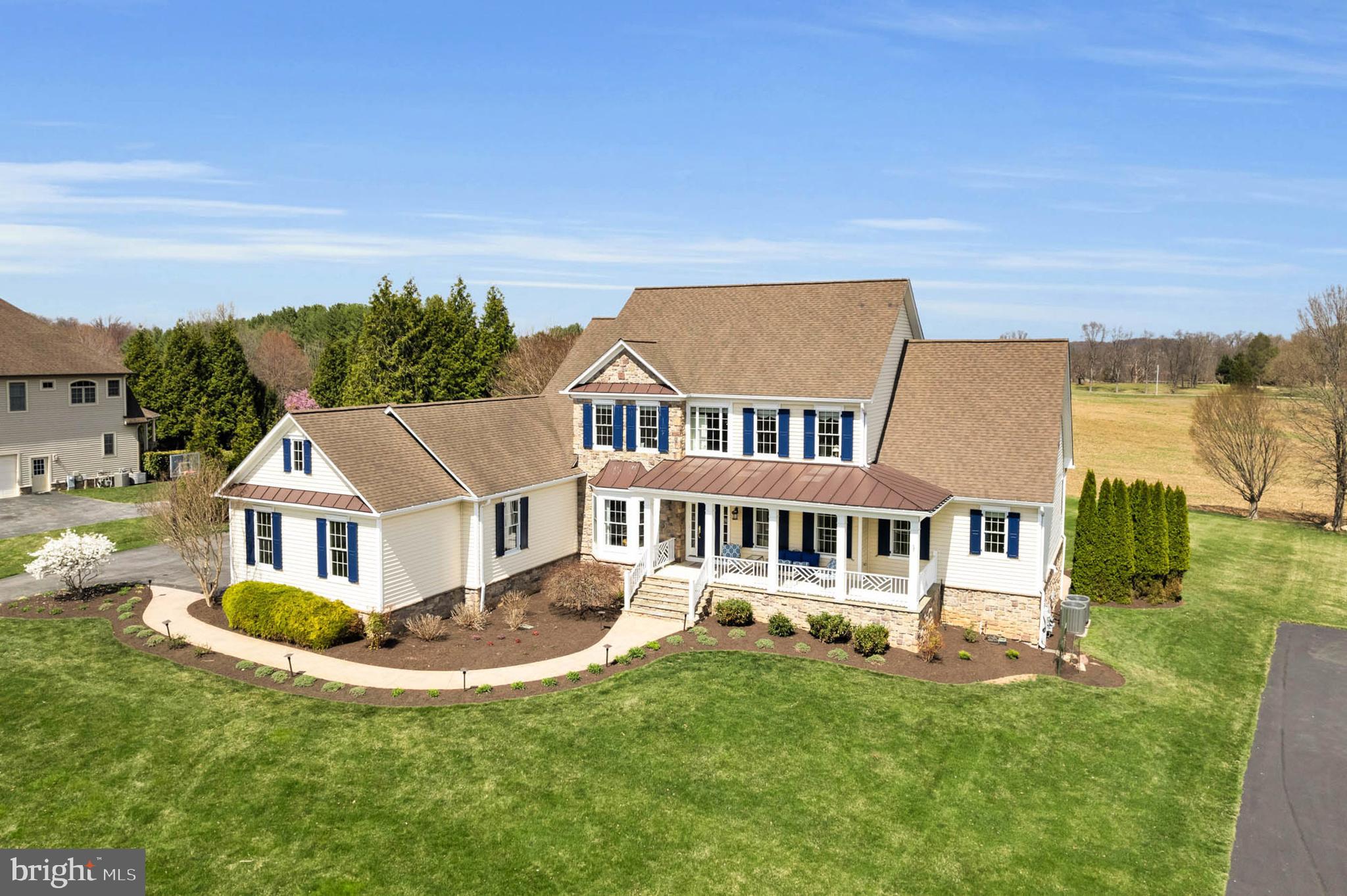 Prepare to be enchanted by this magnificent custom-built residence, boasting over 5,200 finished square feet and nestled on just under an acre of meticulously landscaped and hardscaped grounds. This home artfully combines comfort and luxury, creating the ultimate sanctuary for modern living.

Step into the impressive gourmet kitchen, a culinary enthusiast's dream! Featuring stunning Monogram appliances, elegant granite countertops, a spacious island with a breakfast bar, a gas cooktop complemented by a stylish range hood, double wall ovens, and a built-in microwave and wine fridge, this kitchen is designed for both functionality and elegance.

Adjacent to the kitchen, the grand two-story family room invites you to unwind by the cozy gas fireplace, creating a warm and inviting atmosphere. The main level also showcases a sophisticated formal dining room adorned with exquisite crown molding and chair rails, complete with new custom curtains that enhance the room’s elegance. The welcoming living room features refined architectural details, and a sophisticated library complete with French doors—perfect for quiet reading or a productive workspace.

Retreat to your luxurious main-level master suite, an ideal escape at the end of the day. The en-suite master bathroom offers a spa-like experience with dual sinks, a large soaking tub, and a spacious walk-in closet that provides abundant storage. Family and guests will enjoy the upper level, which features four additional well-appointed bedrooms, each with its own en-suite full bathroom, freshly painted and adorned with new, sparkling hardwood flooring, ensuring privacy and comfort for everyone. The convenience of a main-level laundry room with a new washer and dryer, along with a large mudroom equipped with a pet shower, enhances everyday living.

For even more entertaining space, venture down to the finished basement, where you'll find a lively game room complete with a pool table, a serene den, a sixth bedroom, a full bathroom, an exercise room and a generous unfinished storage area, all featuring new carpeting and fresh paint.

If outdoor entertaining is your passion, this home is truly a dream come true! Access the stunning low-maintenance deck from either the kitchen or the main-level master bedroom, leading to a charming flagstone patio complete with a built-in firepit and delightful water feature. The stamped concrete lower patio further enhances your entertaining options, providing ample space for gatherings both indoors and outdoors. Plus, your furry friends will be safe with an electric fence, and two collars will be included.

Don’t miss the opportunity to call this extraordinary property your home!