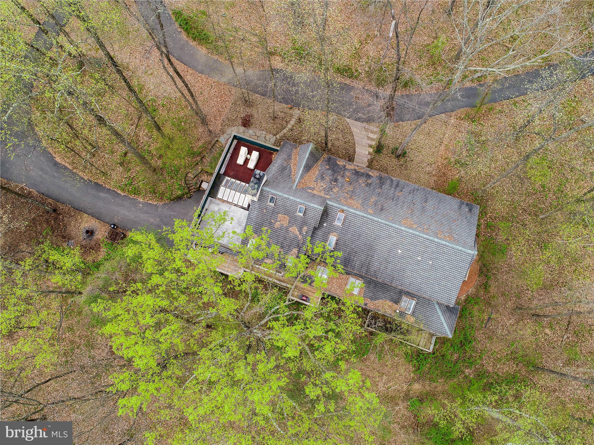 IN THIS TOPSY-TURVY WORLD OF OURS TODAY, THIS HOME OFFERS A NATURE DRIVEN, PRIVATE OASIS DELIVERING SOLITUDE AND A "QUIET" THAT IS RARELY ACCESSABLE! IT FEELS MORE LIKE A MOUNTAIN RETREAT WITHOUT THE MOUNTAINS....ARTISTS, AUTHORS, ACADEMICS ET AL, COULD BE INSPIRED IN THIS TUCKED AWAY,  UNIQUELY INDIVIDUAL SETTING WHILE LIVING IN A SPECTACULALLY CUSTOM BUILT HOME BY A MASTER CABINET MAKER. *********************************************************************************************************************Exquisite Home with Arts and Craft inspirations from the 1910 era. MUST BE SEEN! TRULY one of a kind!  No expense spared in this architecturally original masterpiece. Will be appreciated by the most discerning and astute architectural aficionado. Exquisite and understated, this home lives large with tremendous character and warmth while presenting a comfortable, unpretentious lifestyle. Subtle interior details are rich with quality and thoughtful design, leaving nothing overlooked. Copy of Frank Lloyd Wright fireplace and custom cabinetry throughout with inspired design. Several unusual ceiling designs add unique charm. A grand chef s kitchen, with butler's pantry, sets the stage for the best of cooking and entertaining. Enjoy the extensive porches, large sunroom, great room and open floor plan. Huge lower level with 10 ft. ceilings allows for endless possibilities for craftsmen, artists, or hobbyists, or could easily be built-out for additional living space for a growing family, in-laws, or nannies. A private retreat nestled amongst mature woodlands for the utmost of privacy and tranquility! Adjacent to property-additional 1 acre buildable lot available for purchase.