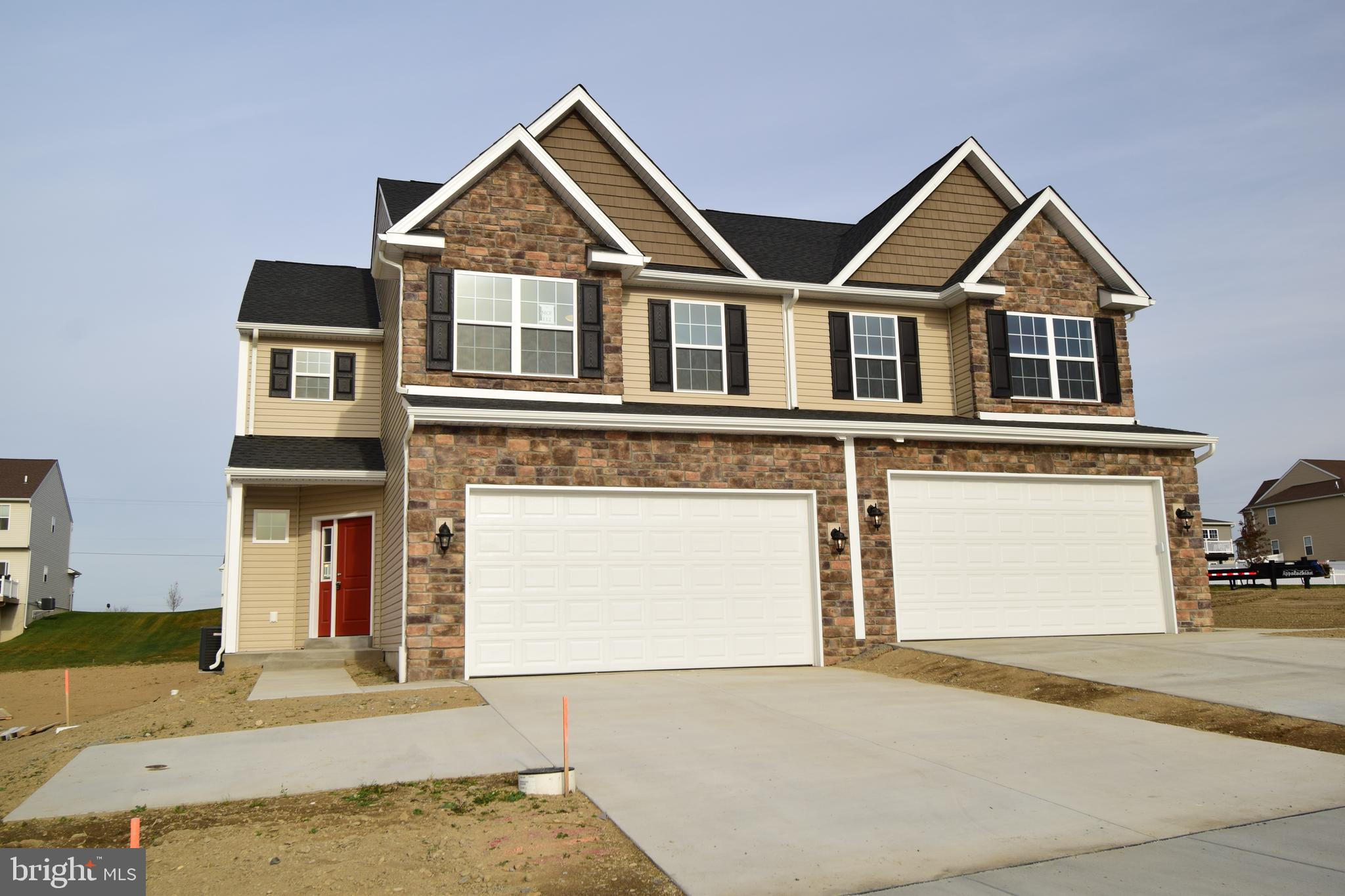 5.375% SPECIAL PROMOTION FOR THIS COMPLETED DURHAM MODEL ON LOT 112!  Take advantage of the Builder's locked in 5.375% interest rate and move right in to this beautiful home! The spacious design of the Durham includes over 1,800 square feet of living space! Starting with the unique private/angled entry and covered porch, you're immediately drawn into the living room, with easy access to the two-car garage and first floor powder room. Quickly store coats, shoes, or spare linens in the linen closet as well. Beyond the living room is the dining room with tray ceiling that is open to the kitchen, providing an air of open living, yet separated by a knee-wall; perfect for additional decorating space! The L-shaped kitchen includes ample quartz counterspace, including an island with an elevated overhang and accented with a lovely tile backsplash! Just up the split staircase is a full bath with linen closet, and two spare bedrooms, each with large closets. At the end of the hall is a laundry closet that will ensure laundry is an easy task.  Finishing off the Durham is a lovely master bedroom featuring a sitting area, walk-in closet, and en-suite bathroom with a double vanity, and shower.