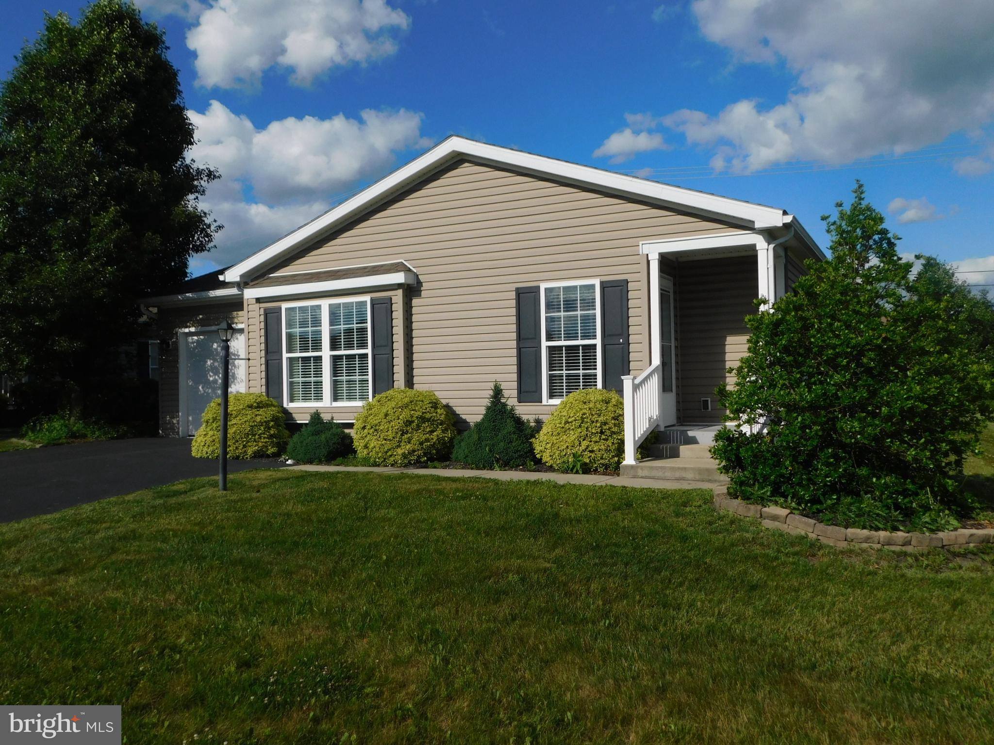 Welcome to 21 Wren Drive in the desirable Spring Valley Village 55+ Community.  Built in 2015 this home features one floor living with an open living area.  The kitchen has been remodeled with new laminated counter tops and electric range The island adds extra storage and counter space with pendant lighting.  The under cabinet lighting provides plenty of lighting for the rest of the counters. The two generous size bedrooms feature ceiling fans for extra comfort. The master bath has a walk-in shower and linen closet plus a walk-in closet. The second bedroom is located in the hall next to the second bathroom with a tub and shower.  The rear of the home features a full width covered porch with ceiling fans for outdoor comfort and relaxation.  Spring Valley Village Community amenities include a clubhouse for community and private activities, library, fitness center and walking trails. Spring Valley offers easy access to route 100, 73 and 422. Schedule your private tour today.