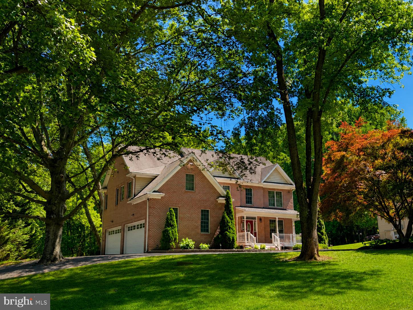 Exceptional Custom-Built Colonial Nestled On 1.95 Private Acres, Offering 5 Bedrooms, 4.5 Baths, And An Impressive Blend Of Luxury, Functionality, and Space.  A Circular Driveway Creates A Grand First Impression And Leads To Both The Attached 2-Car Garage And A Remarkable Two-Story Detached 2-Car Garage Complete With Electric And A Bathroom—Perfect For Car Enthusiasts, Hobbyists, Additional Storage, Or Workspace Needs.
Step Inside To Discover Refinished Hardwood Floors Throughout The Main Level, Enhanced By Extensive Crown Molding, A Gas Fireplace , Chair Rail Detailing, And Quality Craftsmanship At Every Turn. The Gourmet Kitchen Is Designed To Impress, Offering Ample Space For Cooking, Gathering, And Entertaining. The Main Level Also Features A Convenient Bedroom And Full Bath, A Dining Room, A Private Office, And A Well-Appointed Laundry Room Complete With A Dog Shower.
Upstairs, The Luxurious Primary Suite Serves As A True Retreat With Elegant Tray Ceilings, A Huge Walk-In Closet Expertly Designed By California Closets, And Primary Bath Featuring Heated Floors And A Large Shower With Dual Shower Heads. Two Additional Bedrooms Share A Jack-And-Jill Bath, Providing Both Comfort And Convenience. The Fourth Bedroom also has it's very own attached Bath .
For Your Peace of  Mind, This Home Includes A Whole-House Propane Generator With A 400-Amp Automatic Transfer Switch, Two Newly Installed Trane High-Efficiency HVAC Systems, Central Vacuum, Wired Alarm System, Security Camera System, And An Intercom System. Additional Valuable Features  Also Include Two Installed Heavy-Duty Fire-Rated Safes.
Offering The Perfect Combination Of Refined Living, Modern Amenities, And Exceptional Craftsmanship, This One-Of-A-Kind Property Provides Privacy, Space, And Luxury In A Beautifully Maintained Setting. A Rare Opportunity To Own A Truly Extraordinary Home.