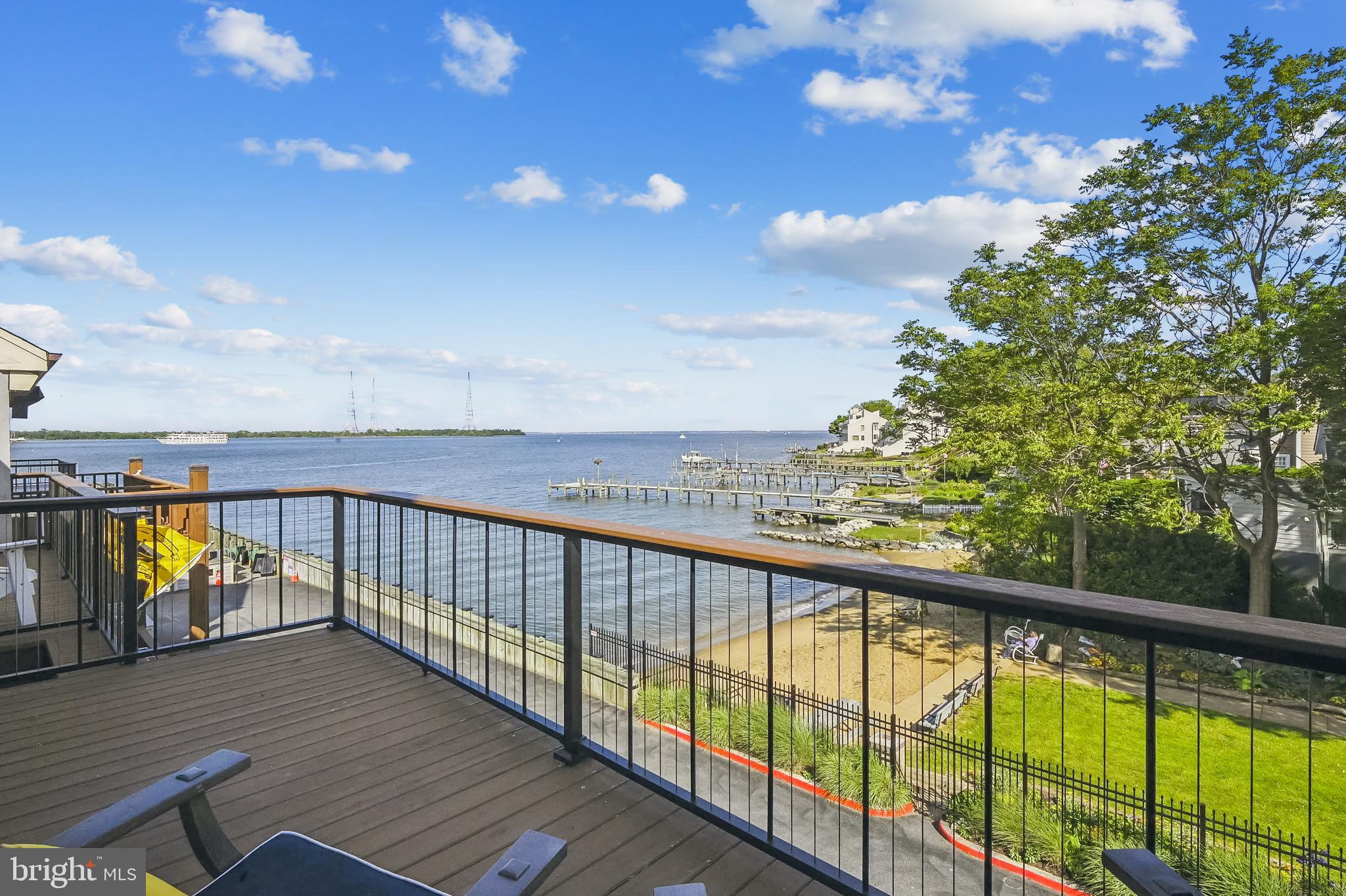 Welcome to 12 Chesapeake Landing. A four-level townhome with amazing water views in the gated community of Chesapeake Landing. This one truly has it all with a two-car garage and private elevator.
Your East exposure provides amazing coffee sunrises and shaded afternoons on your recently renovated decks with cable railings and retractable awning. 

A kitchen designed with the wine enthusiast in mind featuring a refrigerated wine cellar with shelves that cradle your wine and slide out for easy viewing of your collection. Kitchen skylights, designer tile backsplash, vaulted ceiling, and ample storage with Cherry Cabinets and pantry showcase the attention to detail.

Rich hardwood floors, high ceilings, cedar closet, plantation shutters, fireplace, mini split in loft, and design inspired selections enhance the craftsmanship of your home. The main living space highlights the open concept and natural light with panoramic views of the Bay, Beach, and Horn Point Street End Park. 

Returning home from a trip? Ride in your elevator with your luggage to your primary bedroom on the third floor with water views. Listen to the waves of the bay outside your bedroom or enjoy a nightcap on your private deck.  
Join the Maryland Yacht Club and enjoy the pool, tennis courts, and deep-water slips providing easy access to the Severn River and Bay.

There is a main-level bedroom and bathroom that is perfect for guests. You can view the Parade of Lights, Wednesday sailing races, July 4th fireworks, Navy Vessels, and of course the Blue Angels from your decks.  Guests will be calling.

Don't miss out on your opportunity to own a rare and magnificent piece of property in the heart of Eastport. Enjoy a leisure walk or quick water taxi ride to downtown Annapolis with 47 fine restaurants and boutique shops. 

This one has it all. Truly vacation where you live.

Click on tour for interactive floorplan.