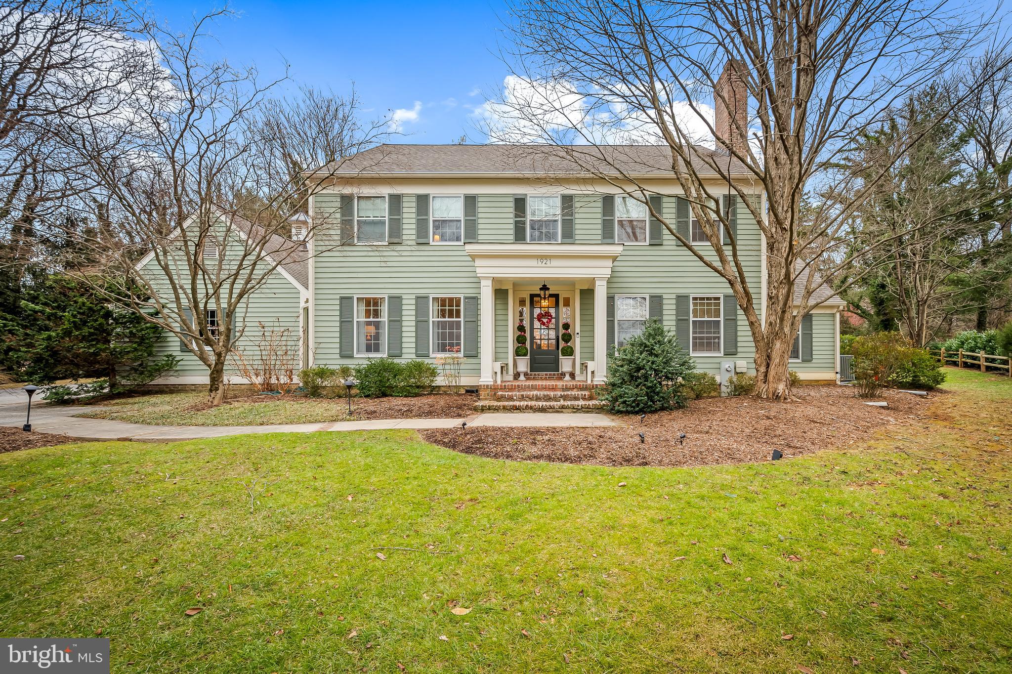 Welcome to 1921 West Joppa Road, a custom-built home nestled on over an acre of lush, mature landscaping, providing ultimate privacy and tranquility in a peaceful neighborhood. This stunning residence boasts unique architectural design, with expansive windows that fill each room with natural light. High-end finishes such as gleaming hardwood floors, custom cabinetry, and luxurious fixtures create an elegant atmosphere. The main level is perfect for both relaxation and entertaining, featuring a grand foyer, a cozy living room with a wood-burning fireplace, and a formal dining room with an exquisite chandelier. The family room, with custom built-ins and a brick fireplace, leads to a stone patio, extending the living space outdoors. A gourmet kitchen with stainless steel appliances, Quartz countertops, a wet bar, and a breakfast nook complete the main level, along with a bright sunroom and quiet office.

The second level of this home is designed for comfort and privacy, offering four generously sized bedrooms. The primary bedroom is a true retreat, featuring two walk-in closets, an attached office space, and a luxurious marble ensuite bath with a soaking tub and separate glass-enclosed shower. Two of the bedrooms share a Jack and Jill bathroom, while the fourth bedroom has its own ensuite bath. All the bedrooms are spacious, with ample closet space and large windows for natural light.

The lower level is designed for leisure, featuring an expansive recreation room perfect for games, movies, or casual gatherings. A bonus room offers the potential for a fifth bedroom, and a full bath provides added convenience. Wine enthusiasts will appreciate the temperature-controlled wine cellar and tasting room, ideal for storing and enjoying a collection. A separate staircase provides direct access to the two-car garage, enhancing convenience.

This home blends luxury, comfort, and functionality throughout, with additional features including two half baths on the main level, a spacious laundry/mudroom, and a large two-car garage. Whether you’re hosting guests or enjoying quiet moments, this home offers both intimate spaces and expansive areas for gatherings. 1921 West Joppa Road combines sophistication with practical living, making it an ideal choice for both family life and entertaining.