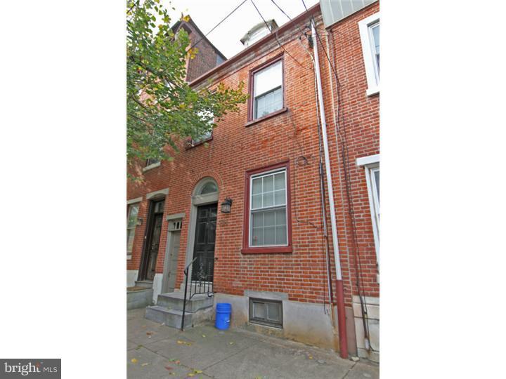 Located just steps away from Liberties Walk, The Piazza, restaurants, pubs, parks, pub. trans and more! This 3 bedroom, 1.5 bath home features original classic details along with modern updates.  Open floor plan first floor with front living area, central dining area, hardwood flooring   powder room. The kitchen has been recently updated and features a large breakfast bar and newer appliances.. The kitchen opens to an abnormally large rear yard for this area. Upstairs find a large front bedroom, recently updated bathroom w laundry room and a large rear bedroom with skylight and balcony/deck. The top floor is another bedroom w exposed beam ceilings. The basement is large and clean, suitable for storage or finishing. This home also features central air and other additional updating throughout.