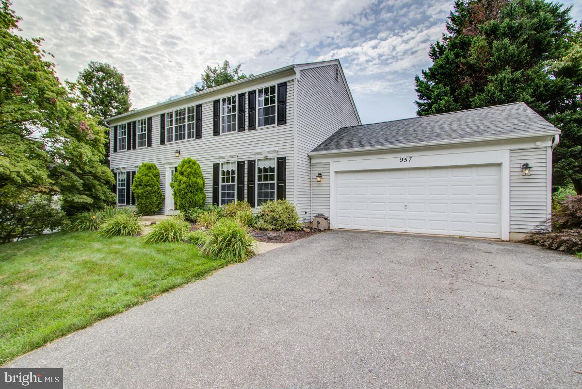 Stunning single family in Gaithersburg! This property is situated on a lush .46 acre lot backing to conservation area. Enjoy 4 bedrooms and 3.5 bathrooms on 3 levels with over 3,300 square feet of living space. The main level features formal living and dining rooms. The living room features a custom built-in shelving unit. The eat-in kitchen in upgraded with granite counters, double oven, and custom cabinetry. Off the kitchen is the huge family room with vaulted ceiling and welcoming views of your backyard. The family room leads you outdoors to your stone patio with built-in brick wood burning fireplace.  There is also a dedicated children's play area. The upper level features 4 bedrooms and 2 bathrooms. The master bedroom is bright with plenty of natural light. It also includes a walk-in closet and ensuite bathroom. The hallway bathroom is upgraded with a gorgeous mosaic tile shower and wood look tile flooring. The lower level is fully finished with additional rec space, storage, and full bathroom. Located within minutes to shopping, restaurants, and local parks. Walking distance to the MARC train! Convenient access off the new Watkins Mill Exit to I-270. Don't forget to view the virtual tour of this stunning home!