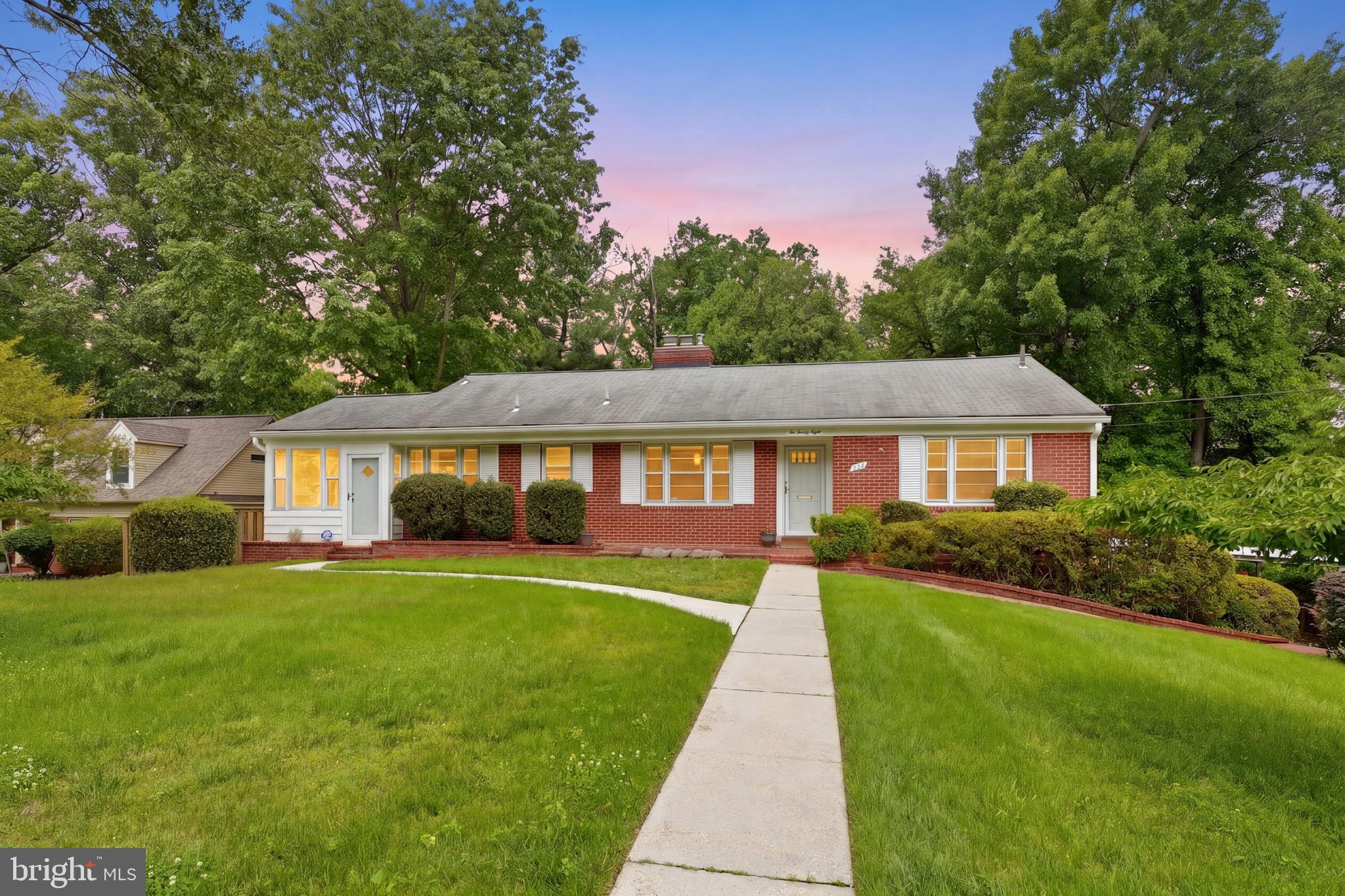 Set on a beautiful half-acre lot in established Burnt Mills Gardens, this expansive brick rambler offers space, character, and a setting that is increasingly hard to find in close-in Silver Spring.

Inside, stunning wood floors, two fireplaces, and generously sized living spaces create warmth and personality throughout the home. A large family room addition overlooks the backyard, while the screened porch provides a wonderful space for relaxing, entertaining, or enjoying the mature landscaping and private outdoor setting.

The layout offers a distinctive floor plan with flexibility for a variety of living arrangements. The main level includes three bedrooms and two full baths, while the finished lower level adds a fourth bedroom, additional full bath, recreation space, and extensive storage.

The kitchen and some interiors offer an opportunity for future updating, making this an appealing option for buyers who value lot size, square footage, architectural character, and location while bringing their own vision over time.

Additional highlights include an attached two-car carport, extended driveway parking, and a deep fenced yard rarely found at this price point. Conveniently located near parks, shopping, dining, commuter routes, and Northwest Branch trails.