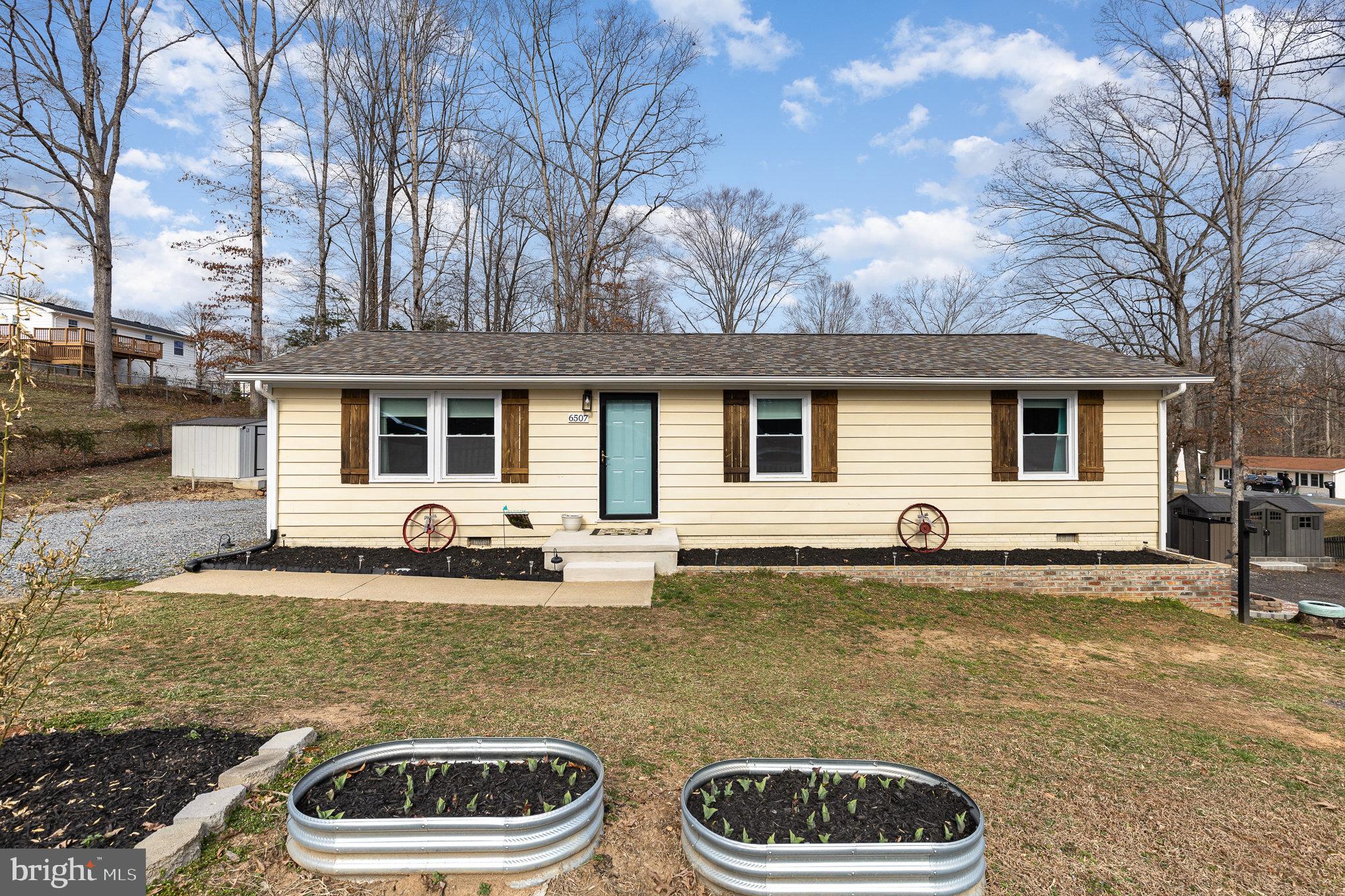 Welcome to 6507 Venison  Drive . This cozy home is move-in ready, with all updates completed in 2020. Nestled on a large fenced corner lot, it's ideal for cookouts and outdoor activities.  Includes two sheds , and conditioned crawl space for storage. Plus, there’s no HOA! Close to restaurants, shopping and commuter lots!

Fun Facts on what's yet to bloom:
Along the back fence and driveway, you’ll find a few banana trees, which reach full growth by late summer.
For fruit trees, there’s a peach tree and a unique hybrid that produces plums, nectarines, and peaches.
The brick garden bed is home to perennials, including daisies, Purple Heart, a rose bush, and resilient Vincas that return year after year.
In the front yard, pink Tulips and Lilies add a pop of color alongside hardy Succulents. And that little tree out front? It’s a Persian lime tree—though it doesn’t bear fruit in this climate!