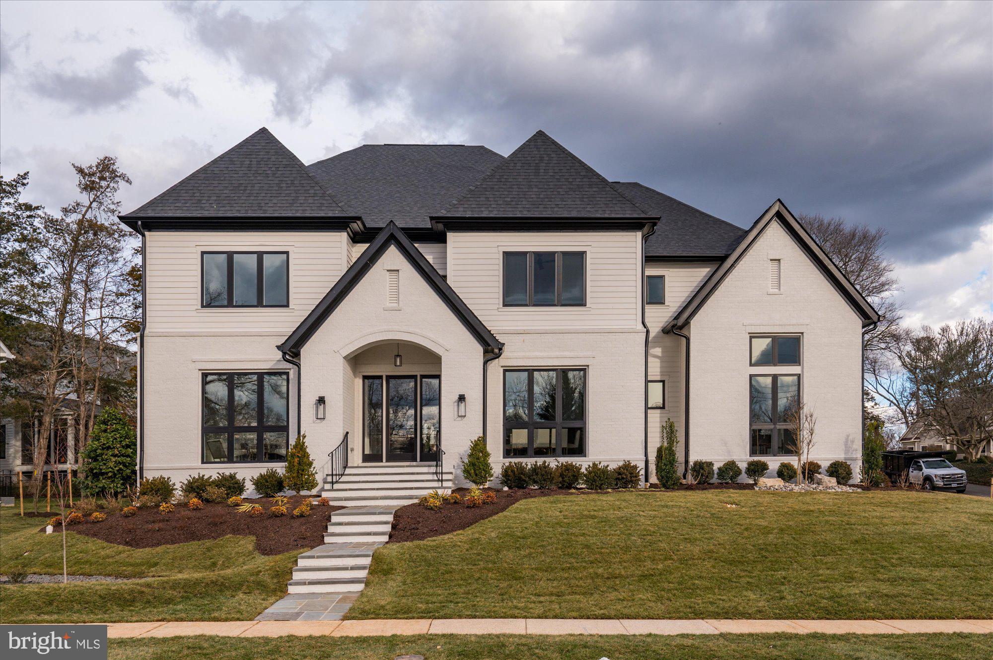 Cherry Hill Custom Homes presents this beautiful transitional design on a quiet street in the Kent Gardens area of McLean. This home features 6 bedrooms, 6 full bathrooms, and two powder rooms with 7100 square feet of finished living space on three levels. The main level boasts 10ft ceilings, gorgeous wide-plank European White Oak engineered wood floors, a gourmet kitchen with Subzero 42" refrigerator, and 48" Blue Star range, frame-less custom cabinetry and quartz countertops. Through the butler’s pantry is a large formal dining room for an unforgettable dining experience. The great room with gas fireplace and tile surround opens to a screened porch and rear patio with Virginia Blue Stone. A guest suite/ private study and a formal living room complete the main level living spaces. The upper level is highlighted by a luxurious primary suite with dual walk-in closets with built-ins, a spa-like bathroom with heated floors, double vanities, stand-alone soaking tub, and heavy glass enclosed shower, three ensuite bedrooms, and a spacious laundry room. The lower level features a rec room with wet bar, an exercise room, an additional ensuite bedroom, a separate powder room, and a large storage space. There is also a built-in elevator shaft for optional conversion. Convenient to Kent Gardens ES/Longfellow MS/ McLean HS, Tuckahoe Recreation Club, downtown McLean, and Tysons.