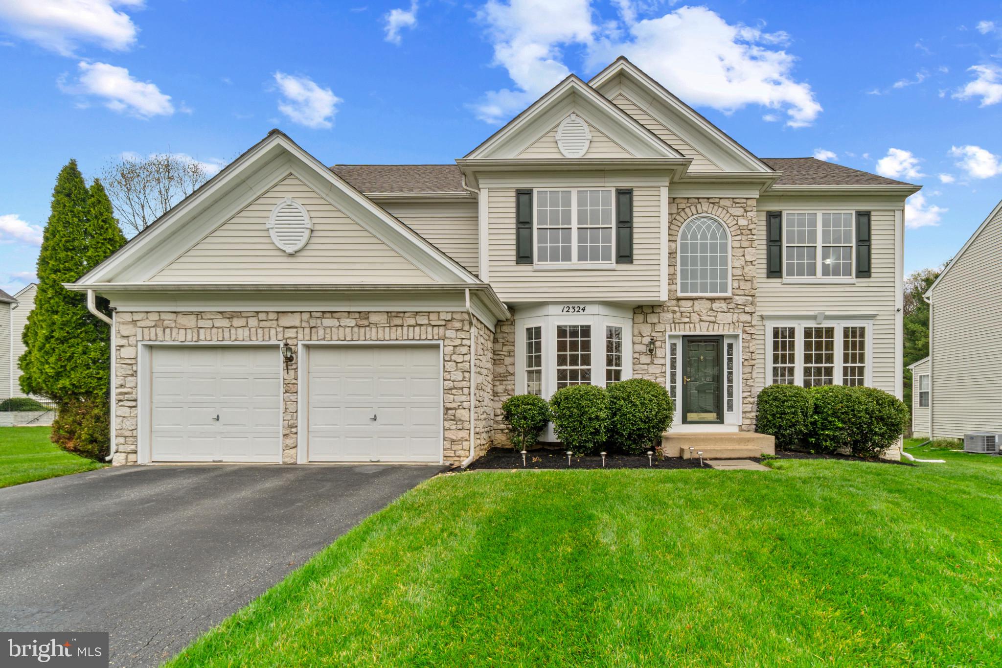 Gorgeous stone-accented Colonial in highly desired Clarks Glen North, beautifully maintained by the original owner and surrounded by meticulously landscaped grounds that enhance its striking curb appeal. Enjoy thoughtful upgrades throughout, including a replaced HVAC system in 2018, a kitchen renovation in 2025, and updates to the main and upper bathrooms in 2023.

Inside, the home showcases a timeless and elegant interior with a traditional yet open floor plan, enriched by refined architectural details. Crown molding and a neutral color palette create a sophisticated atmosphere throughout. Rich hardwood floors extend through the grand foyer, family room, formal living room, and dining room, where wainscoting and bow windows add a touch of charm. A private study with soft carpeting offers a peaceful retreat for work, while a powder room and a laundry room enhance everyday functionality. At the heart of the home, the spacious eat-in kitchen features stainless steel appliances (updated in 2017), ample white cabinetry, a center island with seating, a breakfast bar, a butler’s pantry, a walk-in pantry, and a bright breakfast room with sliding doors that open to the backyard patio—ideal for indoor-outdoor dining and entertaining. Just off the kitchen, the inviting family room impresses with soaring ceilings, hardwood floors, and a cozy gas fireplace.

Upstairs, discover four generously sized carpeted bedrooms and two full bathrooms, including a tranquil owner’s suite with a large walk-in closet, abundant natural light, and a spa-inspired en suite bath with a dual-sink vanity and a jetted soaking tub. The lower level expands the living space with a spacious recreation room, a full bathroom, and walk-out access to the backyard. A dedicated theater room offers the perfect setup for movie nights, while additional storage rooms provide extra convenience. Step outside to a private patio overlooking the spacious and flat backyard—an ideal spot to relax and enjoy the peaceful surroundings of this exceptional home in one of Clarksville’s most sought-after neighborhoods.
