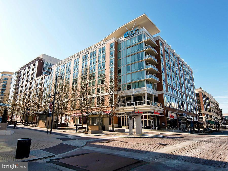 JUST LISTED.  Beautiful residence that features over 1300 sq feet all on one level, two bedrooms and a den w/an exterior balcony, floor to ceiling windows, hardwood flooring, SS Appliances & granite counter tops AND garaged parking.  Shuttle Service to King Street Metro is available. Unit is available immediately. Rare opportunity.