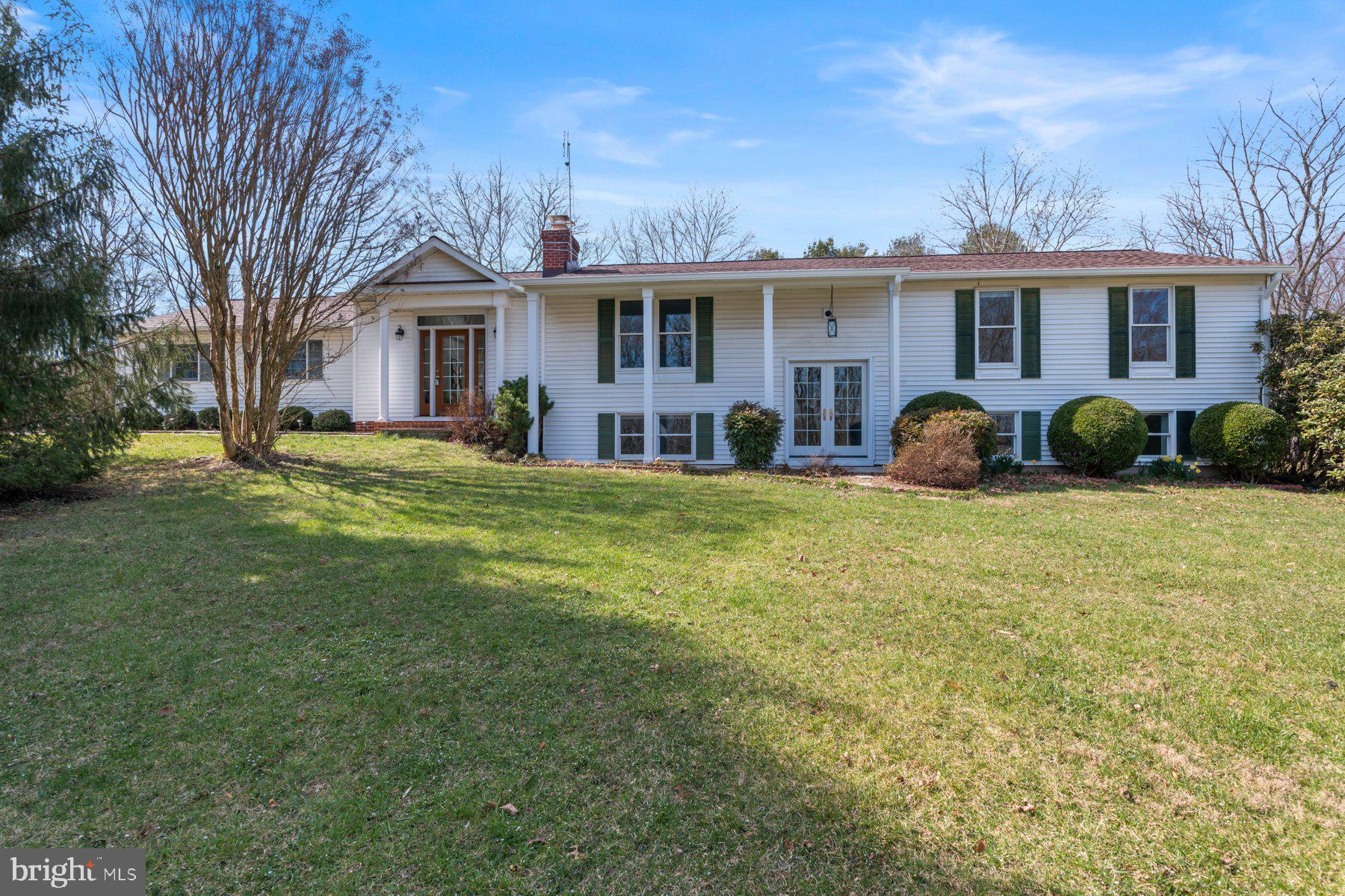 Welcome to this charming split-level home nestled in the serene landscape of Howard County. With 5 bedrooms and 3 full baths, this property offers a perfect blend of comfort and functionality.
Upon entering, the main level greets you with the warmth of hardwood flooring that flows seamlessly throughout. The first living room boasts a cozy wood-burning fireplace with a mantel, complemented by abundant natural light that illuminates the space. Adjacent is the open kitchen, complete with all new stainless steel appliances, granite countertops, a kitchen island, and ample space for dining. Double doors lead to the covered deck, offering a tranquil retreat with breathtaking views of the surrounding outdoors.
A second living area awaits, featuring lofty ceilings adorned with skylights and easy access to the outdoors. The primary bedroom displays comfort and functionality with an attached bathroom featuring a tub shower, heated tile flooring, and convenient shelving for storage. Two additional bedrooms on this level offer the same hardwood flooring and share a full bath.
Descending to the lower level, you'll discover a spacious living area adorned with tile flooring and a wood-burning stove, creating a cozy atmosphere year-round. Natural light floods the space, enhancing its inviting ambiance. Two versatile bedrooms with tile flooring and a full bathroom provide flexibility for various needs. Additionally, the heated tile flooring in the basement ensures comfort with individual thermostats, adding a touch of luxury.
This home offers numerous upgrades, including a new well pump (2020), roof and gutters replaced (2022), Geothermal heating and cooling installed (2015), and replacement Andersen Windows and Pella front door (2019), ensuring both comfort and efficiency for years to come.
Outside, the spacious yard is a gardener's delight, boasting beautiful landscaping and an array of fruit-bearing trees and bushes, including blueberry, blackberry, sour cherry, and Lodi apple, as well as a mature asparagus bed.
Conveniently located with easy access to I-70, shopping, restaurants, and trails, this home offers the perfect combination of tranquility and accessibility. Don't miss the opportunity to make this your dream home! Schedule a showing today!!