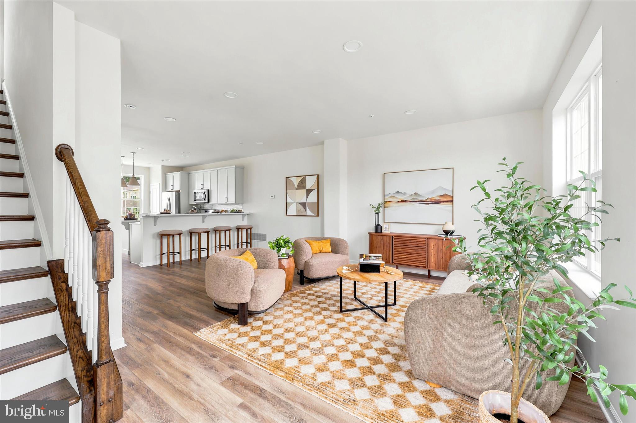 OPEN HOUSE SATURDAY JUNE 13TH 1:00-3:00. Move-in ready! This exquisite, END UNIT townhome spans over 2,100 sqft and is less than 3 years old! Boasting 4 bedrooms and 4 bathrooms (2 full bath+ 2 half bathrooms), it offers a spacious and contemporary living space. Lower level is featuring oversized 2-car garage, office/den space and half bath. Step into the open-concept main level, featuring a kitchen equipped with smart appliances, a sizable island, and ample dining area.  Quartz counter-tops, stainless steel appliances, abundance of natural light flooding through the windows. Access to the private balcony. Upper level has primary bedroom, complete with en-suite bathroom (gorgeous shower and soaking tub!), and expansive walk-in closet, along with 2 smaller bedrooms and hallway full bathroom. Additionally, the upper level hosts a conveniently located laundry room. Ascend the stairs to the upper level, where you'll find generously sized loft bedroom. Don't let this opportunity pass to own this exceptional home in a neighborhood boasting convenient amenities! Walkable to the park and local businesses (cafés, creameries, art-stores)! HOA covers:
Common Area Maintenance, Lawn Maintenance, Snow Removal, Trash, Amenities: Dog Park, Jog/Walk Path