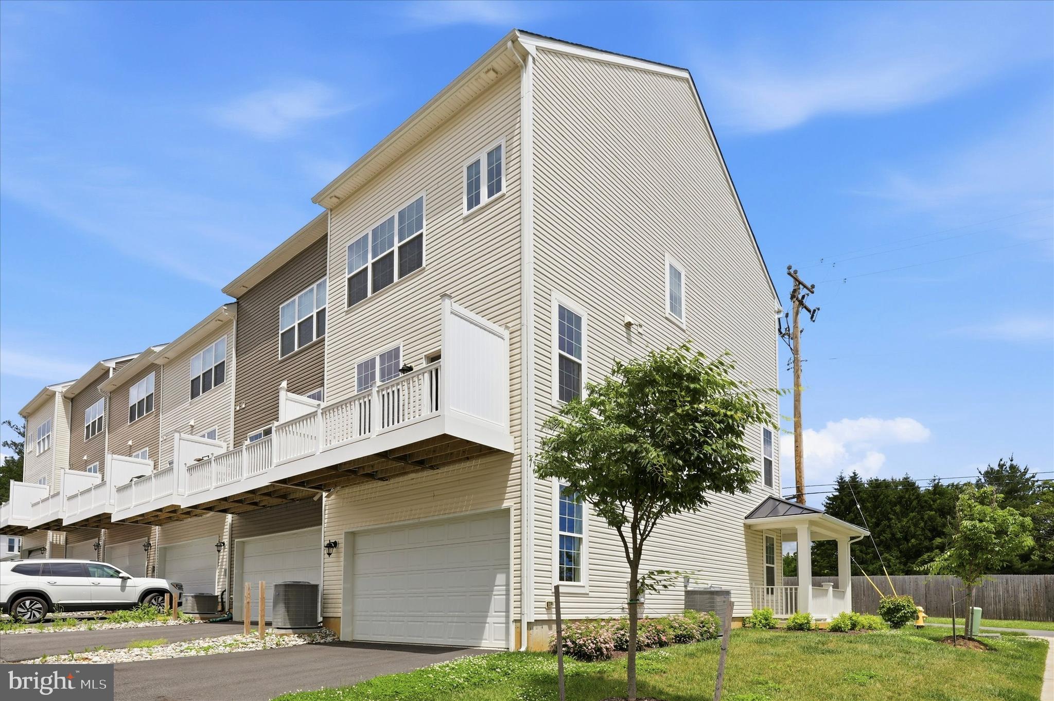 OPEN HOUSE SATURDAY JUNE 13TH 1:00-3:00. Move-in ready! This exquisite, END UNIT townhome spans over 2,100 sqft and is less than 3 years old! Boasting 4 bedrooms and 4 bathrooms (2 full bath+ 2 half bathrooms), it offers a spacious and contemporary living space. Lower level is featuring oversized 2-car garage, office/den space and half bath. Step into the open-concept main level, featuring a kitchen equipped with smart appliances, a sizable island, and ample dining area.  Quartz counter-tops, stainless steel appliances, abundance of natural light flooding through the windows. Access to the private balcony. Upper level has primary bedroom, complete with en-suite bathroom (gorgeous shower and soaking tub!), and expansive walk-in closet, along with 2 smaller bedrooms and hallway full bathroom. Additionally, the upper level hosts a conveniently located laundry room. Ascend the stairs to the upper level, where you'll find generously sized loft bedroom. Don't let this opportunity pass to own this exceptional home in a neighborhood boasting convenient amenities! Walkable to the park and local businesses (cafés, creameries, art-stores)! HOA covers:
Common Area Maintenance, Lawn Maintenance, Snow Removal, Trash, Amenities: Dog Park, Jog/Walk Path