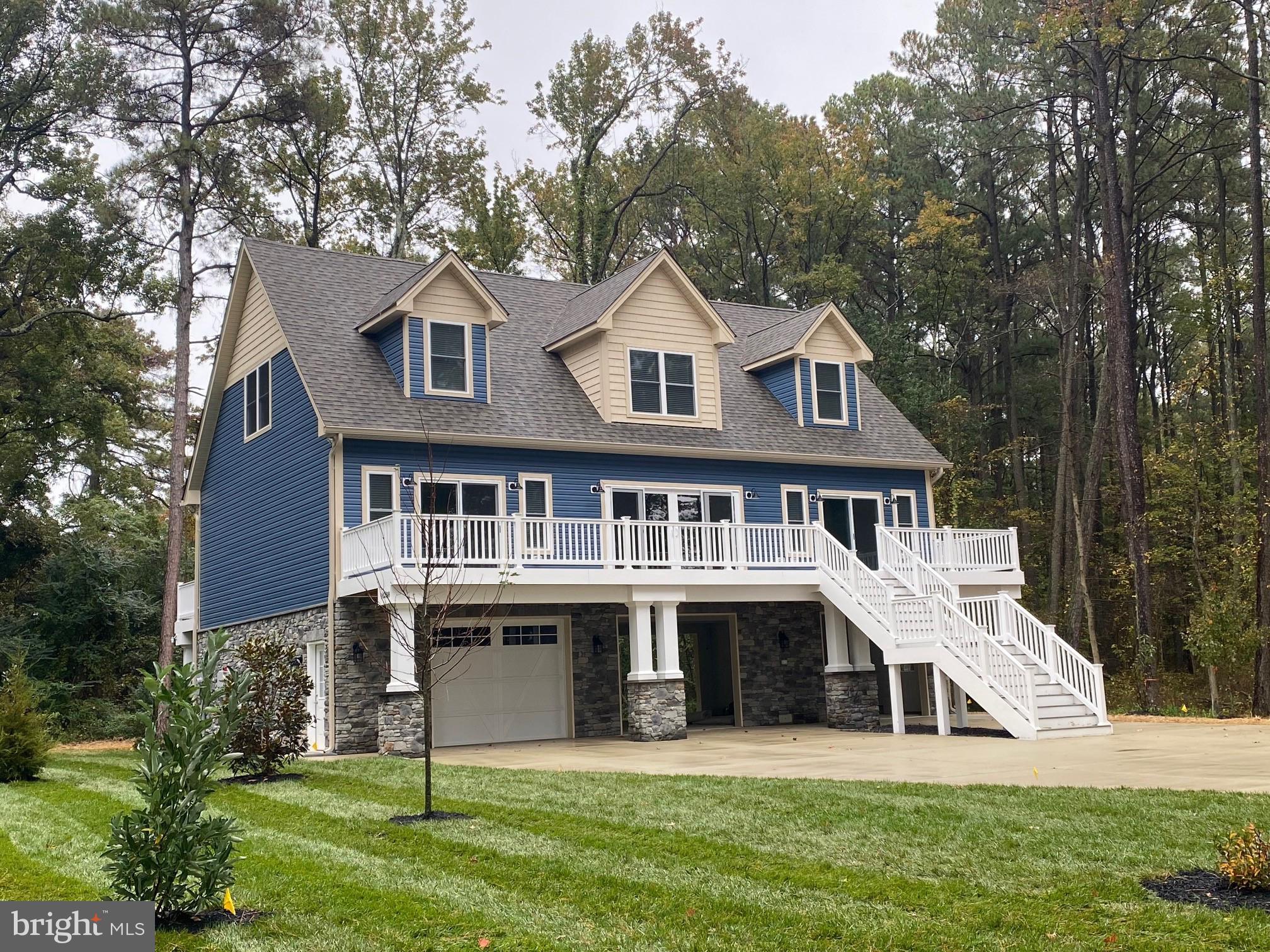 New construction ready in about 30-45 days.  Coastal living floor plan with views of Potomac River.  Main level is  34 x 32 garage area and finished 16 x 32 storage room or workshop.  2nd level is the main living area with open floor plan and master suite.  View  &  sound of the River when out on the deck from master bedroom.  Two large 50 ' decks on front and back of house great for watching the wildlife &  sunsets.  3rd level has 2 large bedrooms , 21 x 12  loft and 5 double dormer spaces great for desks or window seats.  Tons of windows & sliding  doors for extra natural light.  Home will have many upgraded features:  Trim & crown molding, stainless appliances, granite, tiled shower in master,  popular vinyl wood backed flooring in main living spaces, recessed lights, maintenance free decking material.  Driveway will be paved with a  concrete apron.  Yard will have sod & sprinkler system.  There is no access to the water from this lot, water views only.