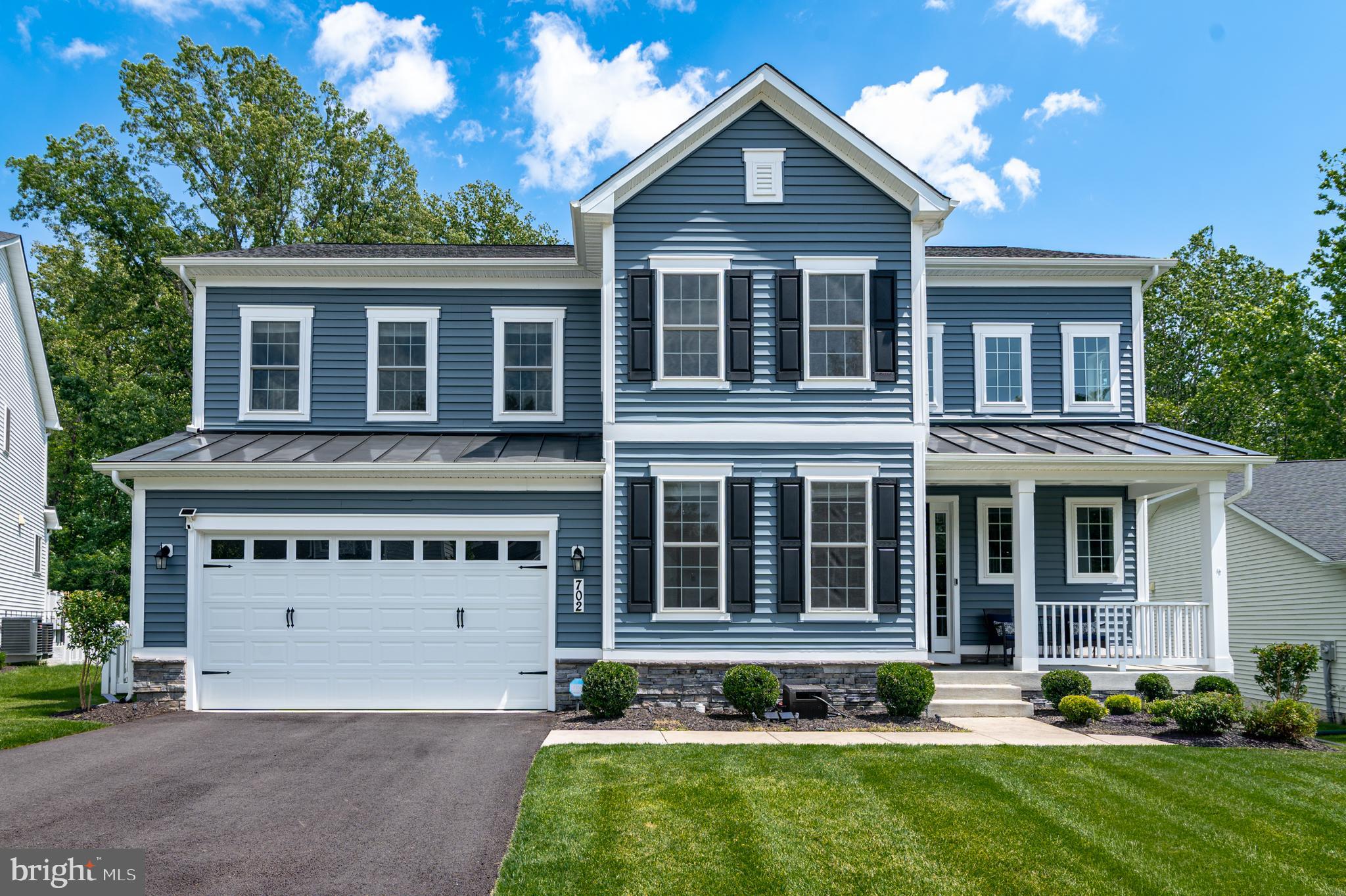 Absolutely stunning and thoughtfully upgraded, this Richmond American Presley model is the dream home you have been waiting for—perfectly positioned on a desirable cul-de-sac with a deluxe lot, private fenced yard, and peaceful views of lush trees. Built in 2022, this 5-bedroom, 4-full-bath home offers three beautifully finished levels, dramatic 10-foot ceilings, 9-foot doors, elegant designer light fixtures throughout, dual HVAC systems, and a 2.5-car garage with Tesla charger and an extra storage bay for motorcycles, golf cart, bikes, or gear.  

***ASSUMABLE FHA loan @2.75%*** Please reach out to the listing agent for more information. INCREDIBLE OPPORTUNITY for savings for the qualified buyer!!

***A welcoming front porch opens to a grand foyer with a wide staircase and elegant sightlines. The main level features LVP flooring, a bright open-concept layout, and a beautifully appointed kitchen with quartz countertops, white shaker cabinetry, herringbone ceramic tile backsplash, 36-inch gas cooktop, double wall ovens including a convection/microwave combo, oversized island with seating, and a walk-in pantry. The dining area is filled with natural light from a gorgeous row of windows and opens directly to the Trex deck with retractable awning and stairs to the large, level backyard. A main-level bedroom and full bath add exceptional flexibility for guests, multigenerational living, or a private office.

***Upstairs, a spacious loft creates a true second living area, enhanced by custom built-in bookcases and charming window benches with storage. The serene primary suite with plush carpet and generous windows overlooks the trees and backyard and features a huge walk-in closet and spa-like bath with double vanities, separate commode, and a beautifully finished shower. Two additional bedrooms, a generous hall bath with double sinks, proper laundry room with sink, and abundant closets complete the upper level.

***The finished lower level continues the elevated feel with LVP flooring, a large rec room, 5th bedroom, 4th full bath, dedicated gym or bonus space under the addition, and an unfinished flex room for storage, hobbies, or future possibilities. Located in sought-after Brunswick Crossing, residents enjoy resort-style amenities including a pool, tennis courts, fitness center, yoga studio, sports fields, basketball, beach volleyball, dog parks, trails, and community garden. With easy MARC train access to DC and Montgomery County plus convenient routes to Northern Virginia, Baltimore, Frederick, and beyond, this home delivers luxury, privacy, space, and an unbeatable lifestyle.