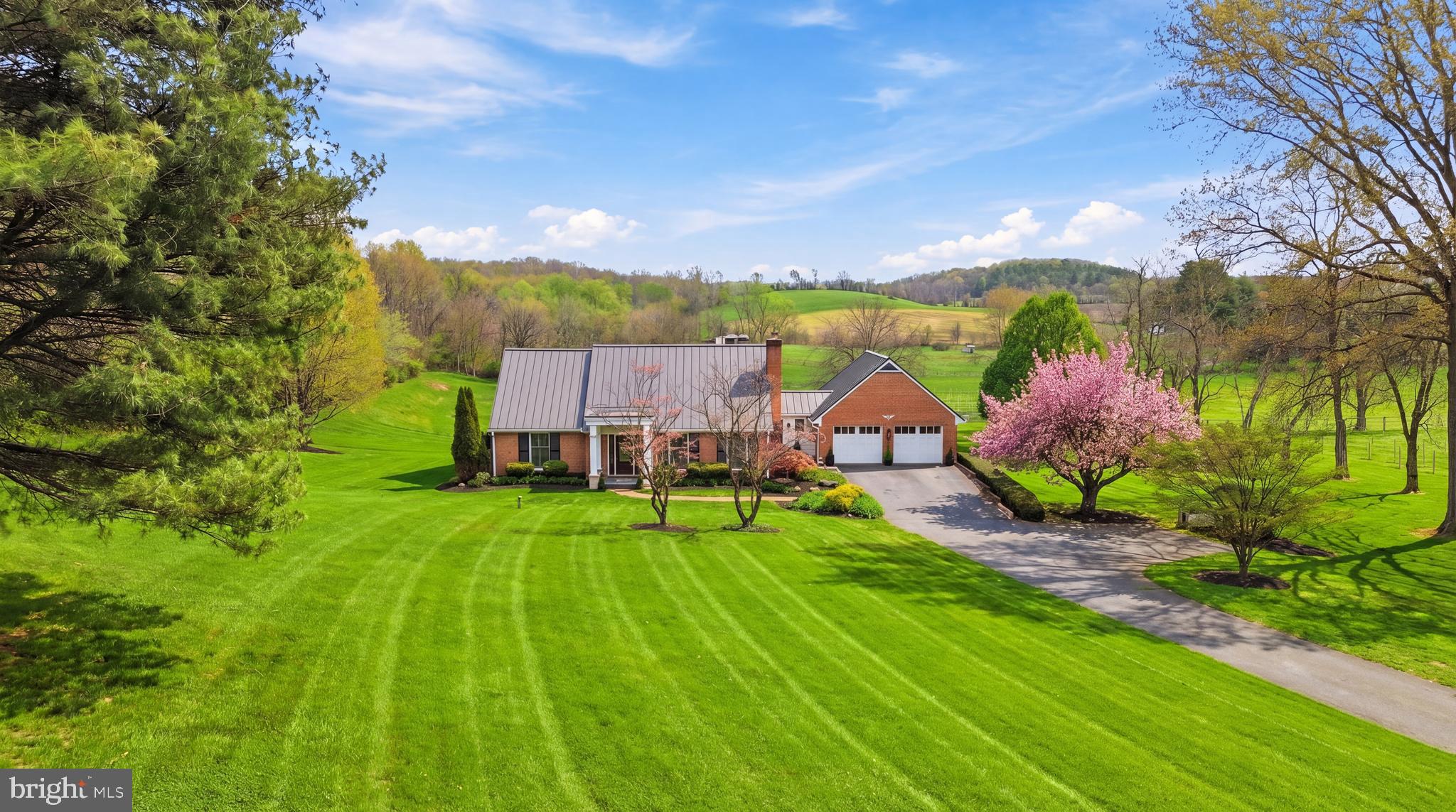 Ideally located in picturesque New Market, this exceptional all-brick home offers the perfect balance of peaceful countryside living and everyday convenience. Set on 3.76 scenic acres, you’re just minutes from grocery shopping, fitness centers, top-rated schools, and a growing selection of local wineries and craft breweries—plus easy access to breathtaking scenic drives that define the area’s charm.

Inside, the home showcases quality craftsmanship across three finished levels, featuring a transitional floor plan designed for comfortable, open living. Enjoy relaxing in the screened porch overlooking a seasonal pond, or take in the panoramic views from the expansive, beautifully landscaped front and rear yards.

Commuters will appreciate the quick access to I-70 and key routes, while historic New Market and downtown Frederick’s dining, boutiques, and cultural attractions are just a short drive away. With no HOA, this property offers both freedom and versatility—truly an opportunity to create your ideal lifestyle in a highly desirable and well-connected location.

Thoughtful updates include a 2024 well pump, 2024 UV light system, AB Martin standing seam metal roof (2024), Anderson windows, updated front portico and walkway, hardwood flooring with custom in-lay, newly renovated bathrooms, closet organizers, paved driveway and chimney caps.